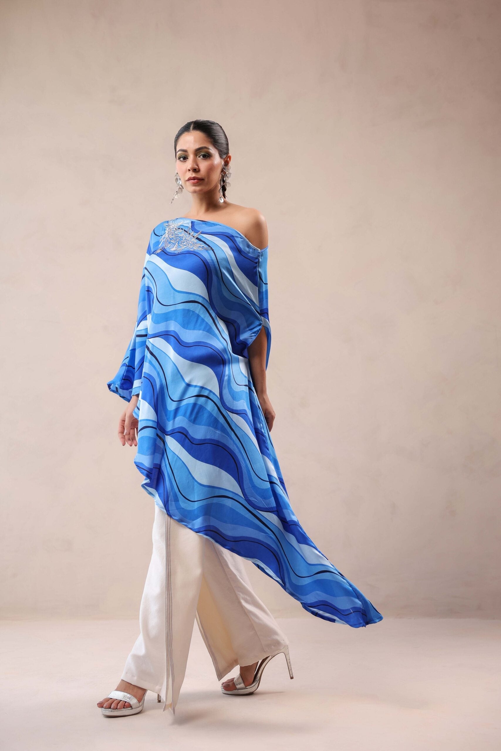 Atlantic Blue cruise cape with creme fall pants.