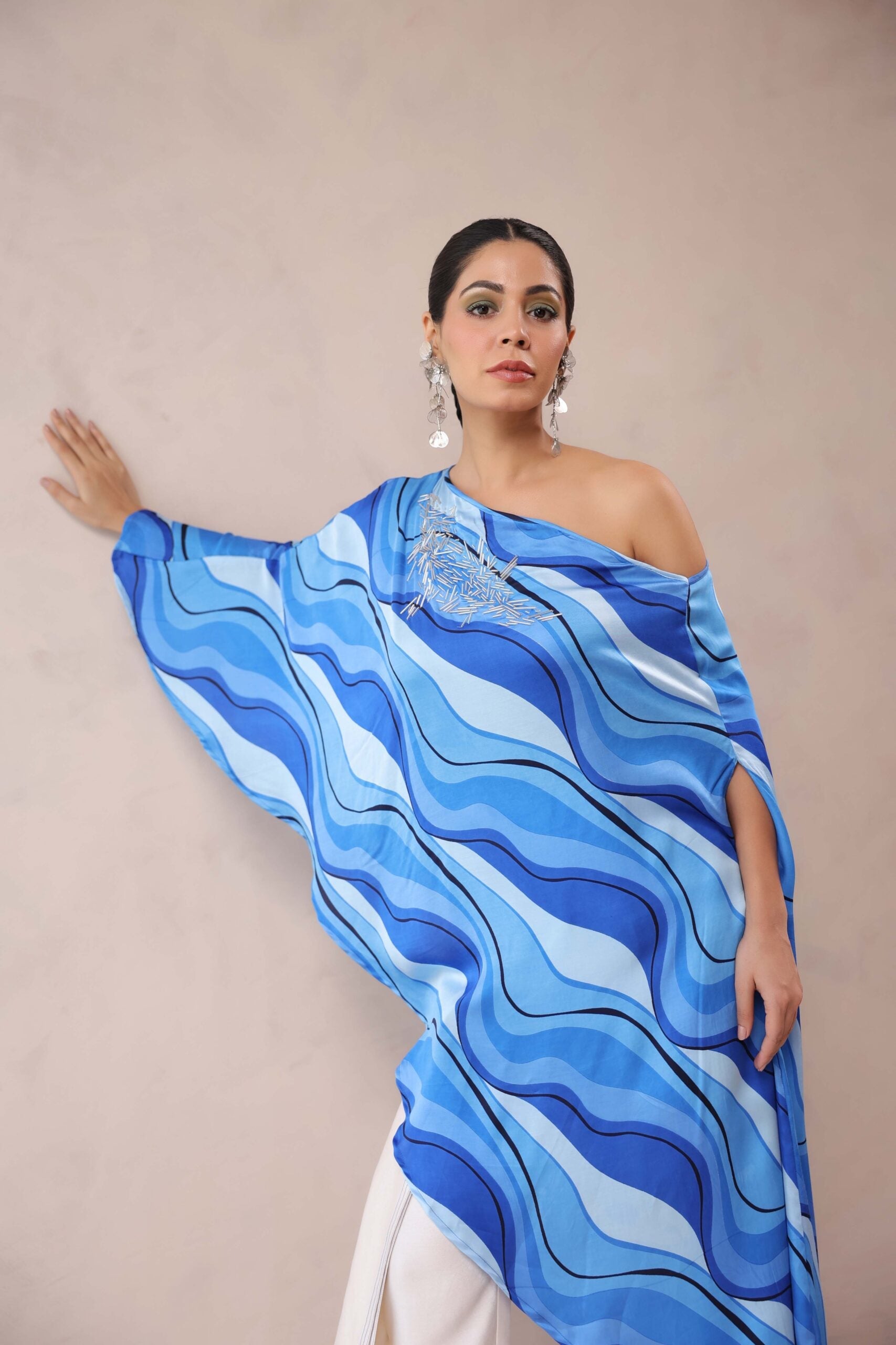 Atlantic Blue cruise cape with creme fall pants.