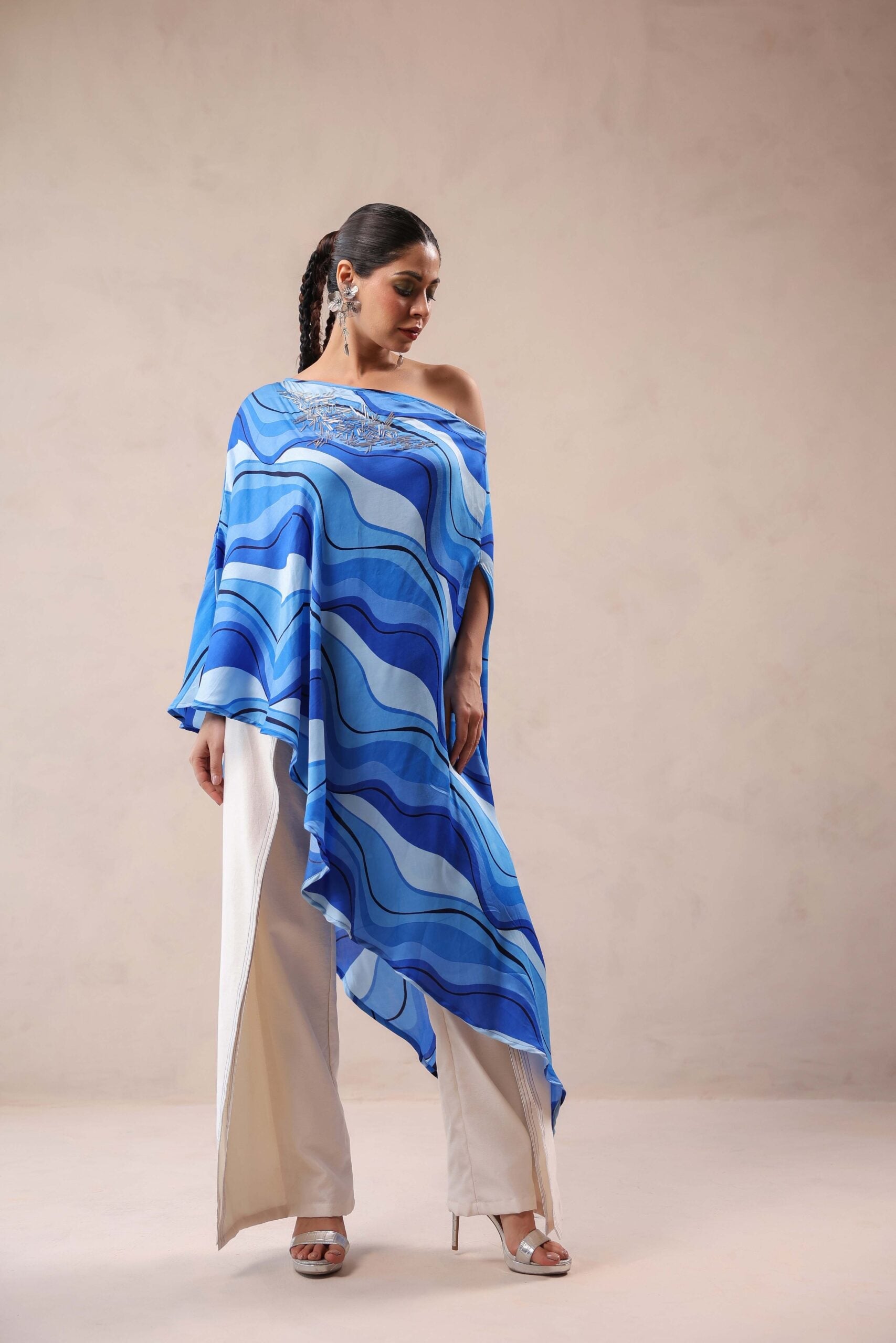 Atlantic Blue cruise cape with creme fall pants.