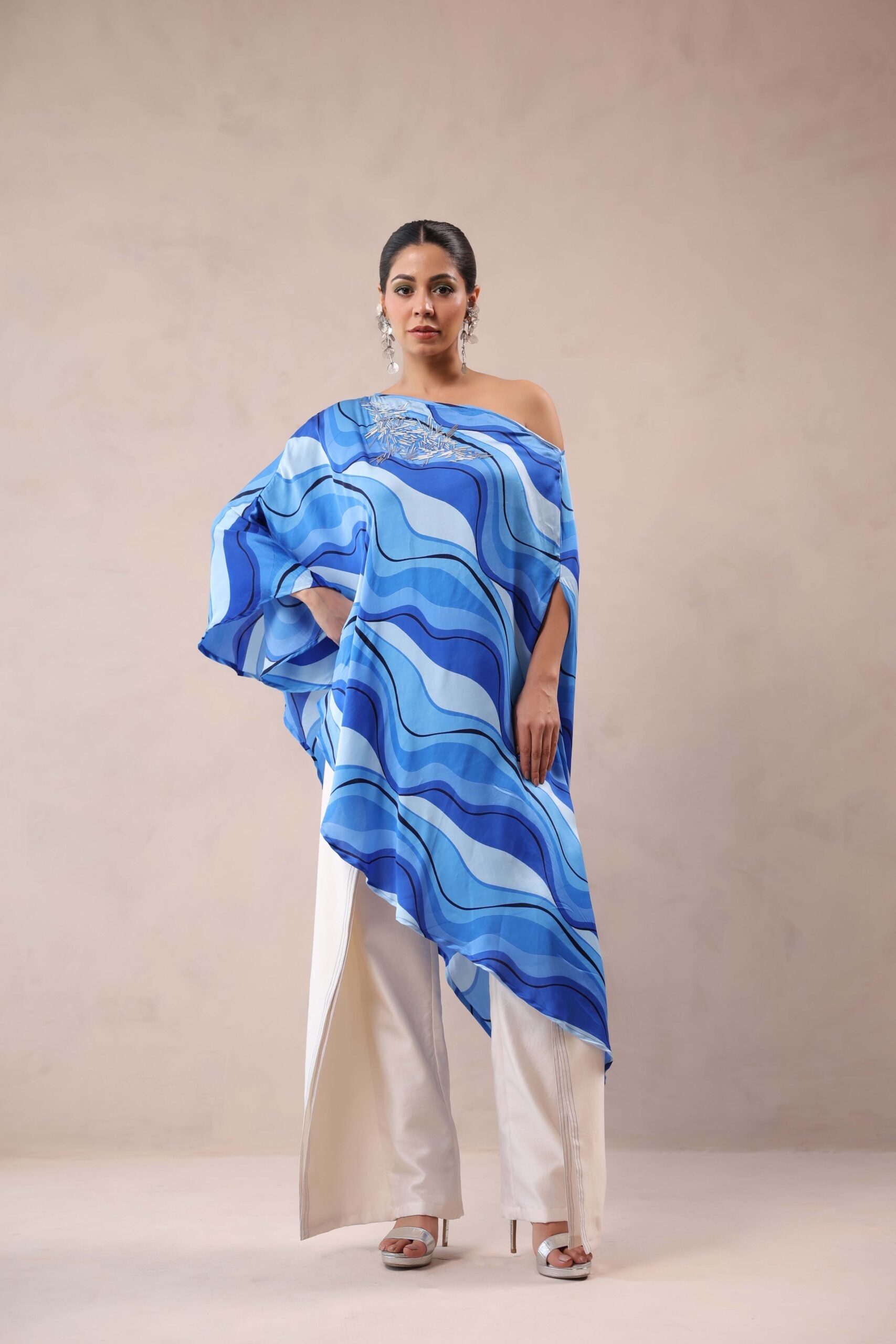 Atlantic Blue cruise cape with creme fall pants.
