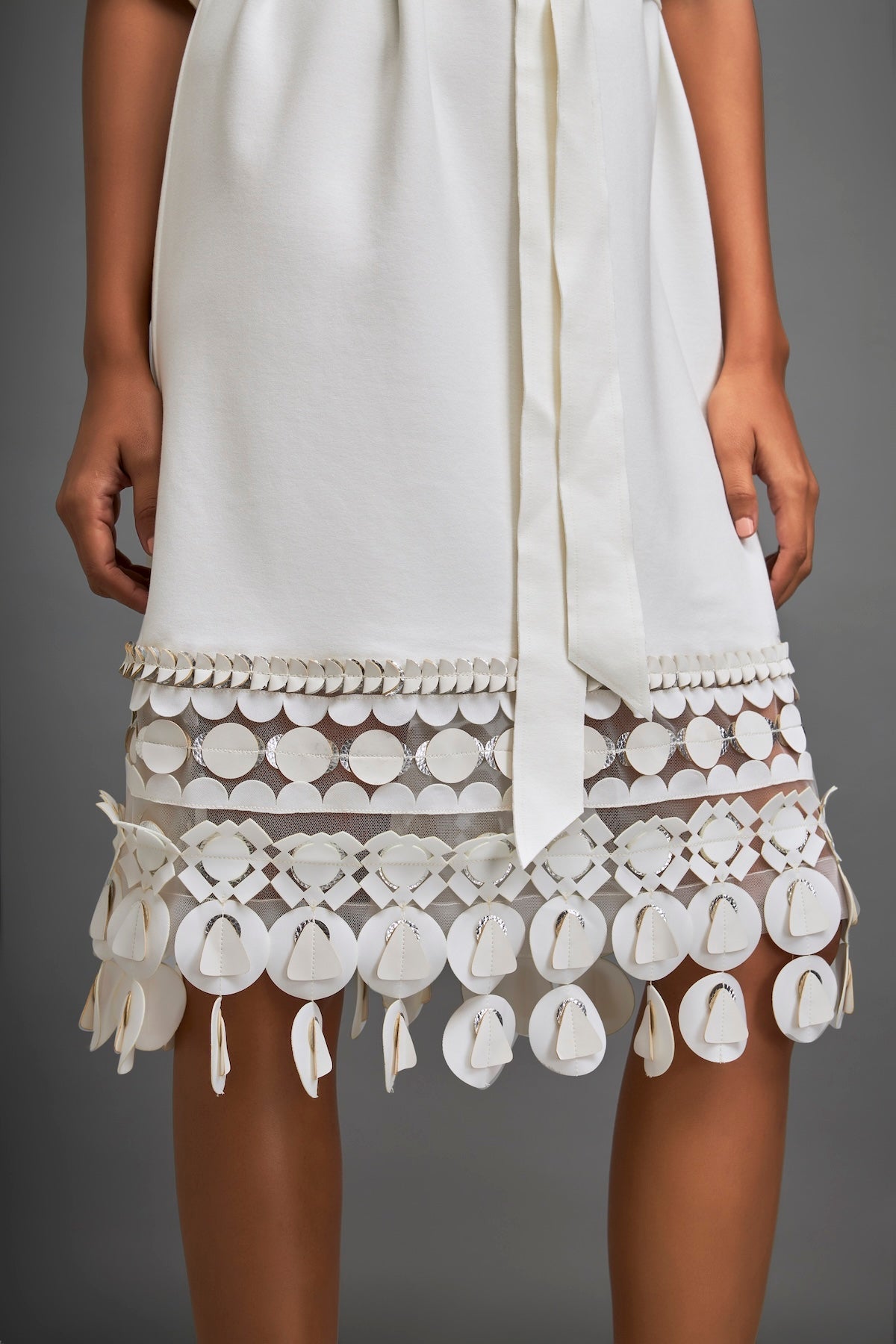 Dress With Belted Waist And Metallic Geometric Hemline