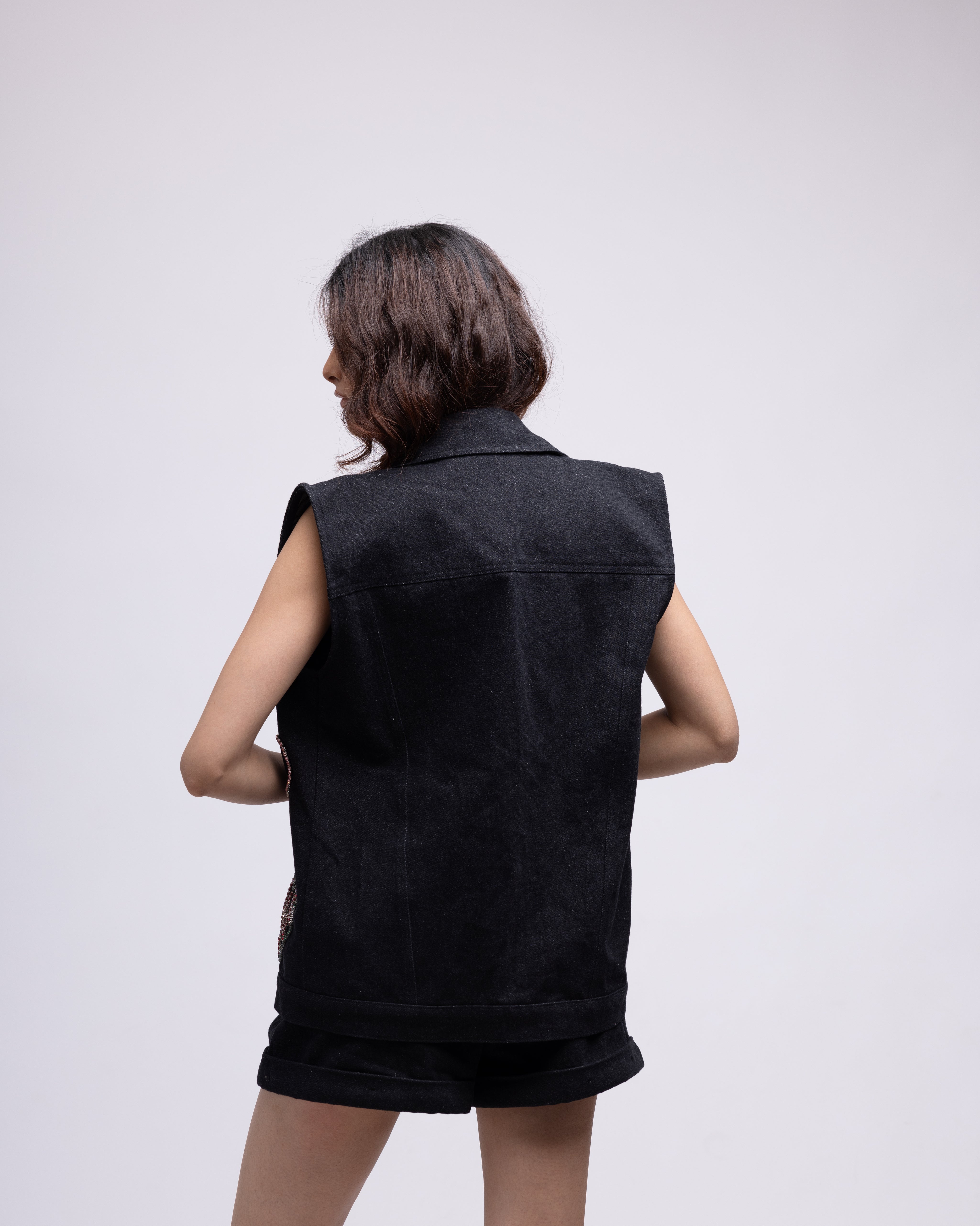 Sleeveless denim jacket with multi-colour embellished hearts