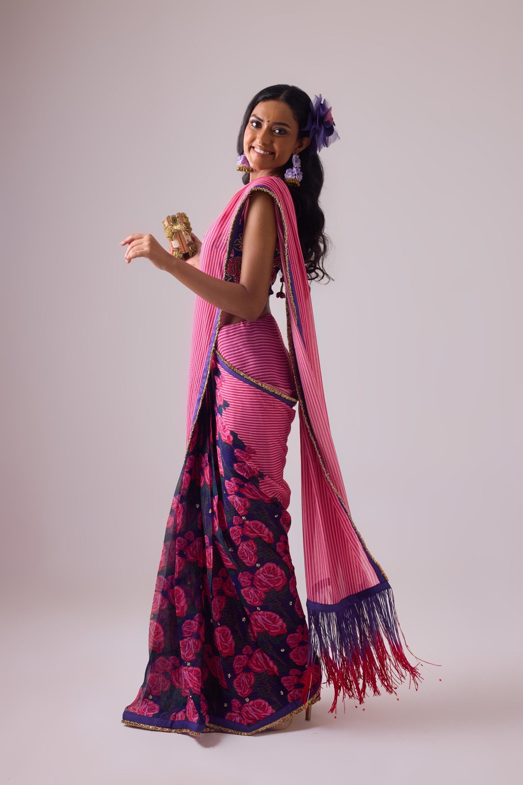 GEORGETTE STRIPED AND ROSE PRINTED SAREE WITH FRINGES DETAIL PAIRED WITH EMB. FLORAL BLOUSE