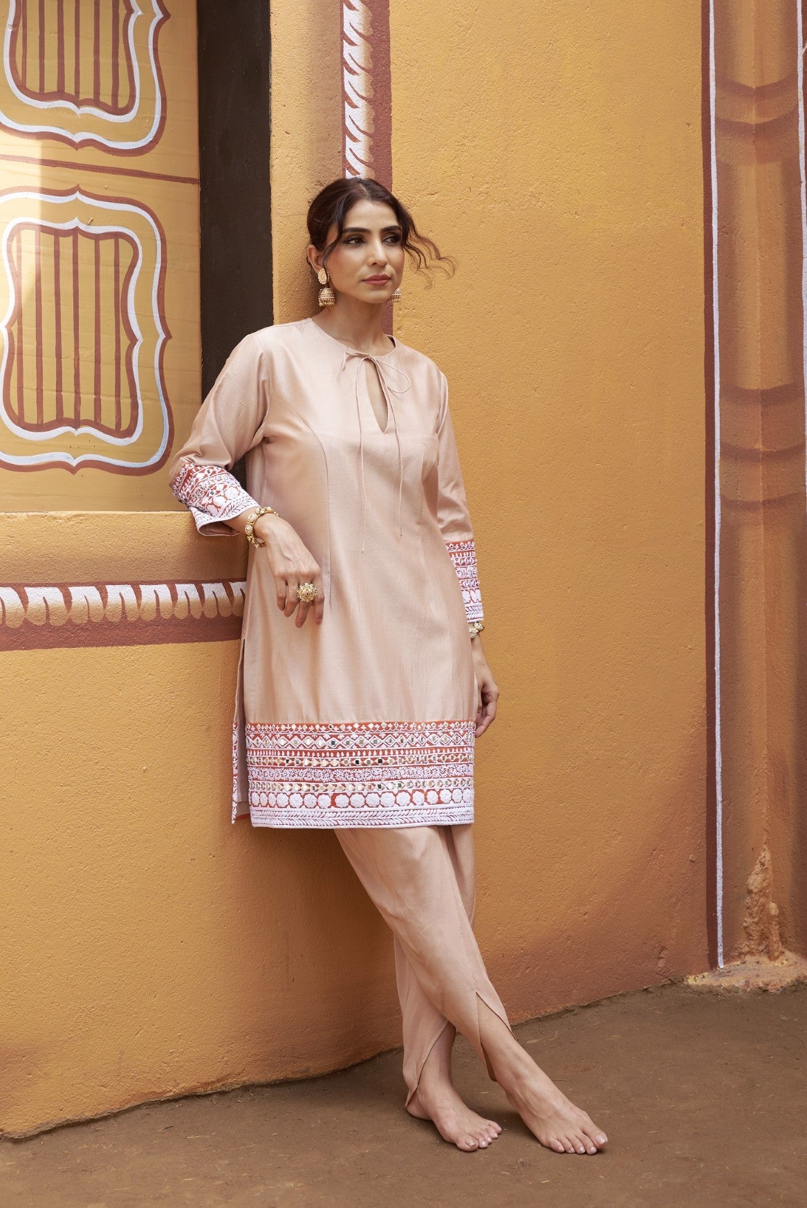 half and half beige kurta with tulip pants