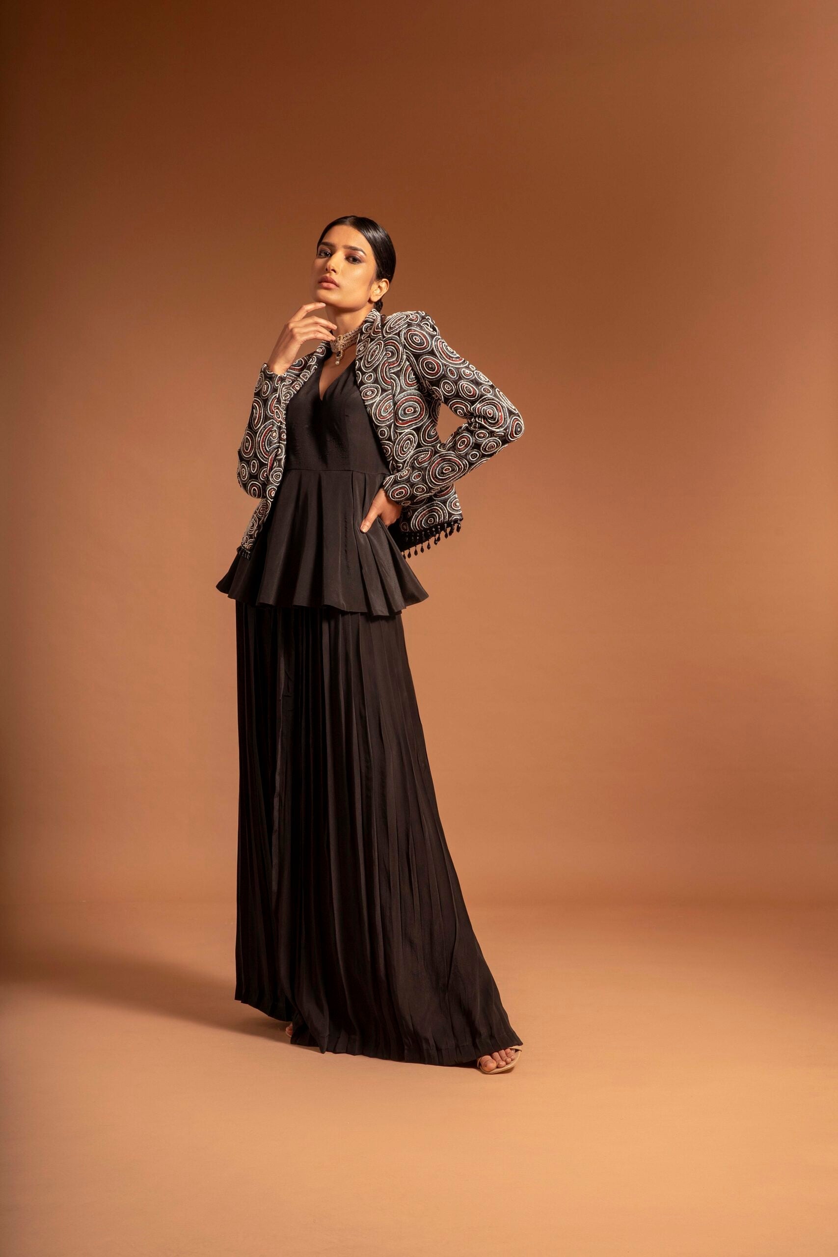 Black fully embroidered jacket with peplum top and pleated pants