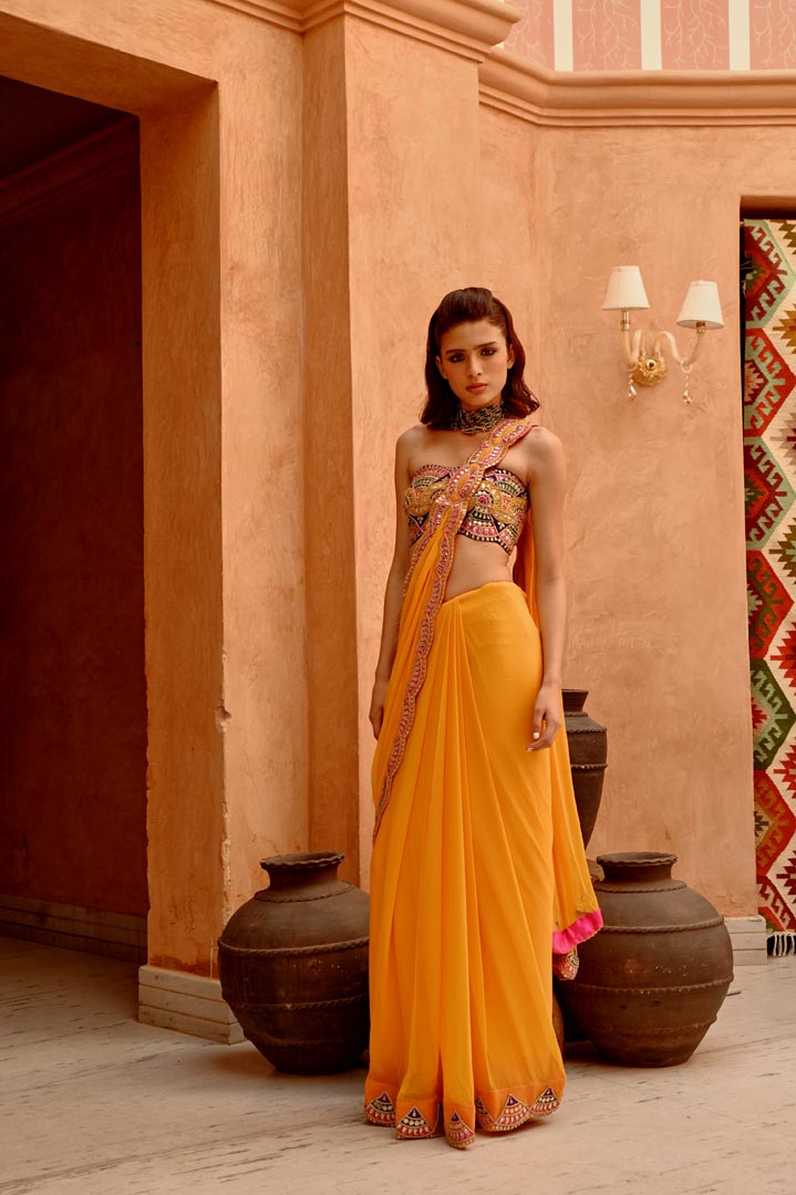 Image of Mango yellow saree with pre-stitched palla and pleats  with bejewelled bandeau blouse