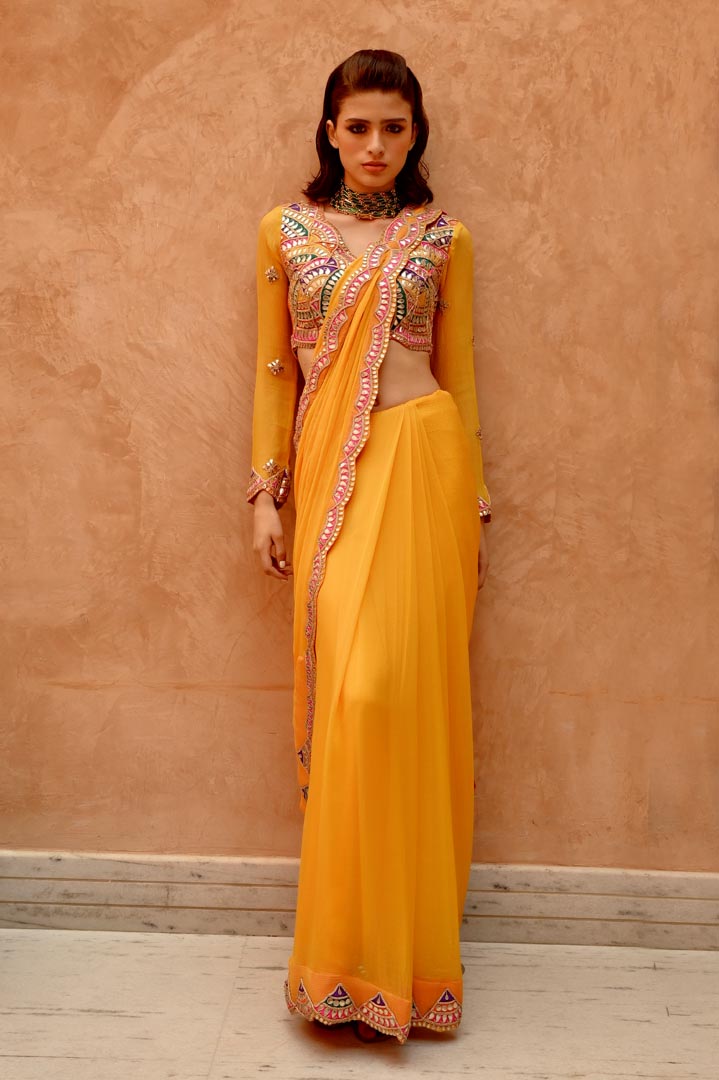 Image of Mango yellow saree with pre-stitched palla and pleats  with bejewelled jaal full sleeve blouse