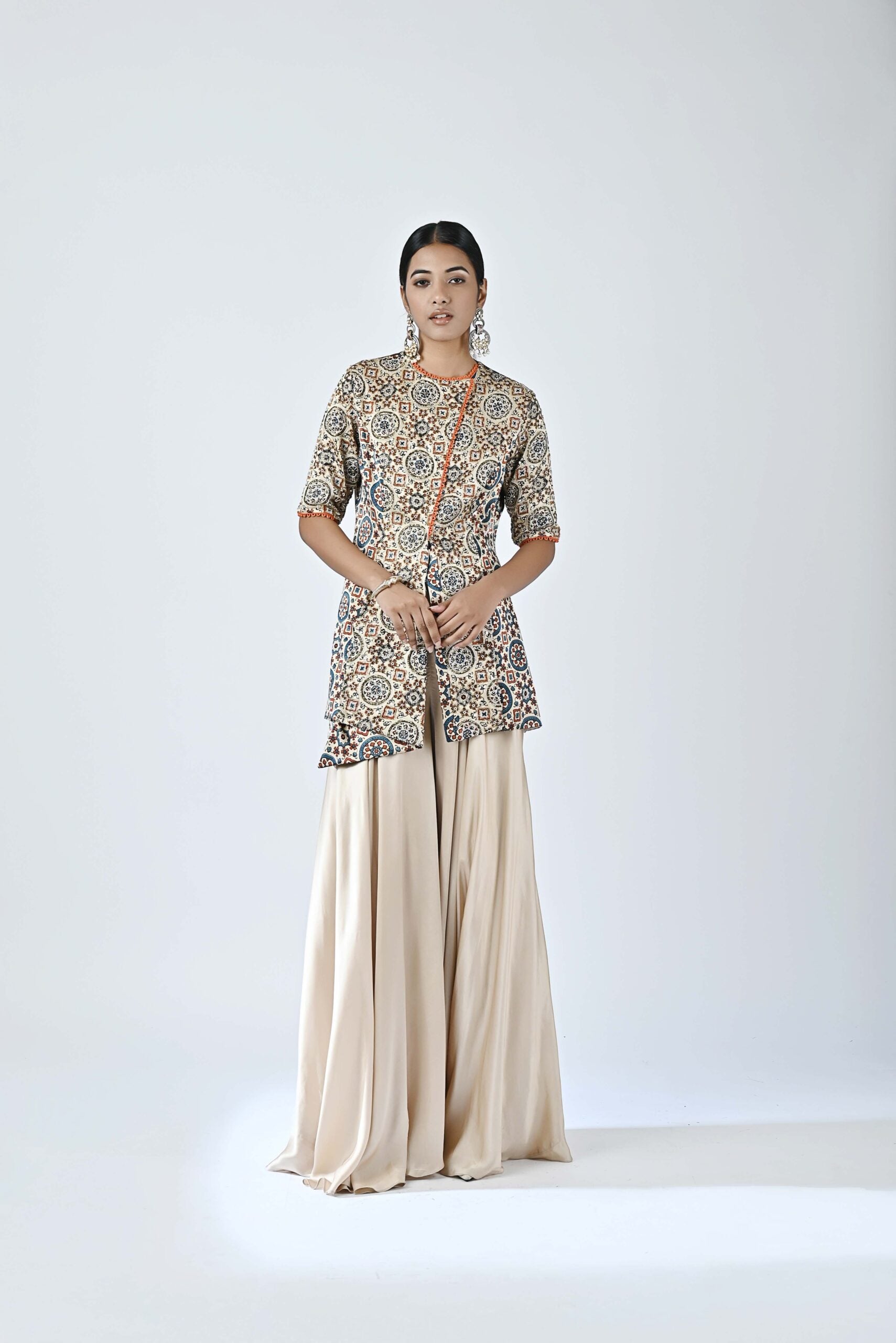 Beige embroidered jacket with flare pants
