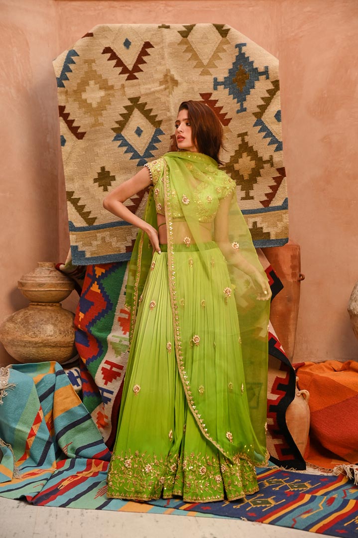 Image of Lime green ombre ruched lehenga with blouse and dupatta