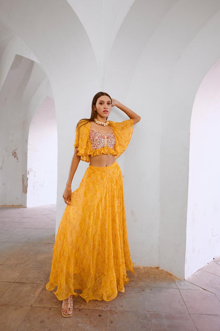 Image of Gulbahar Marigold yellow  jugnu sitara butterfly blouse with flair skirt set.