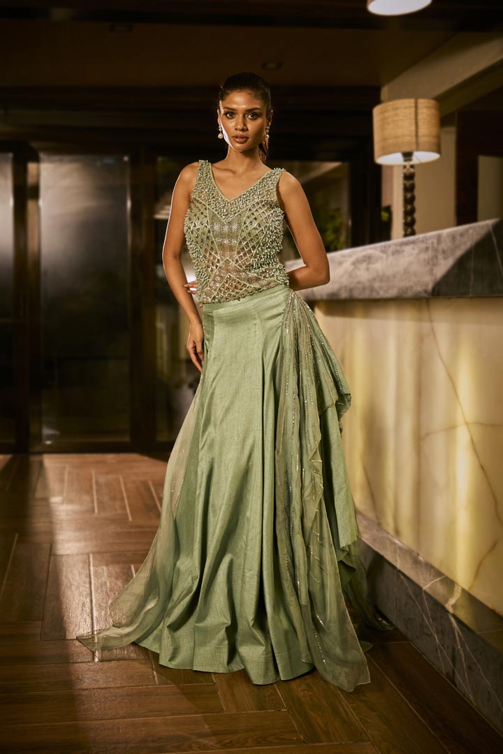 Mint green lehenga set with an embellished blouse