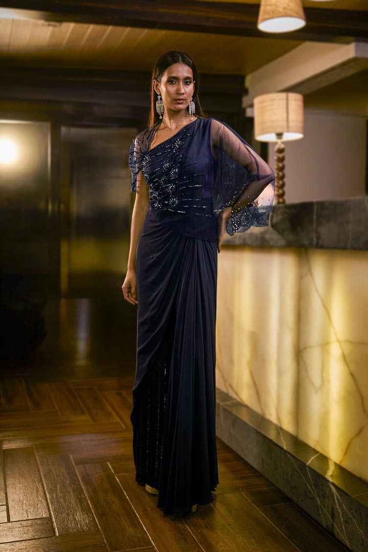 Midnight Blue jumpsuit with sheer sleeve and draped silhouette