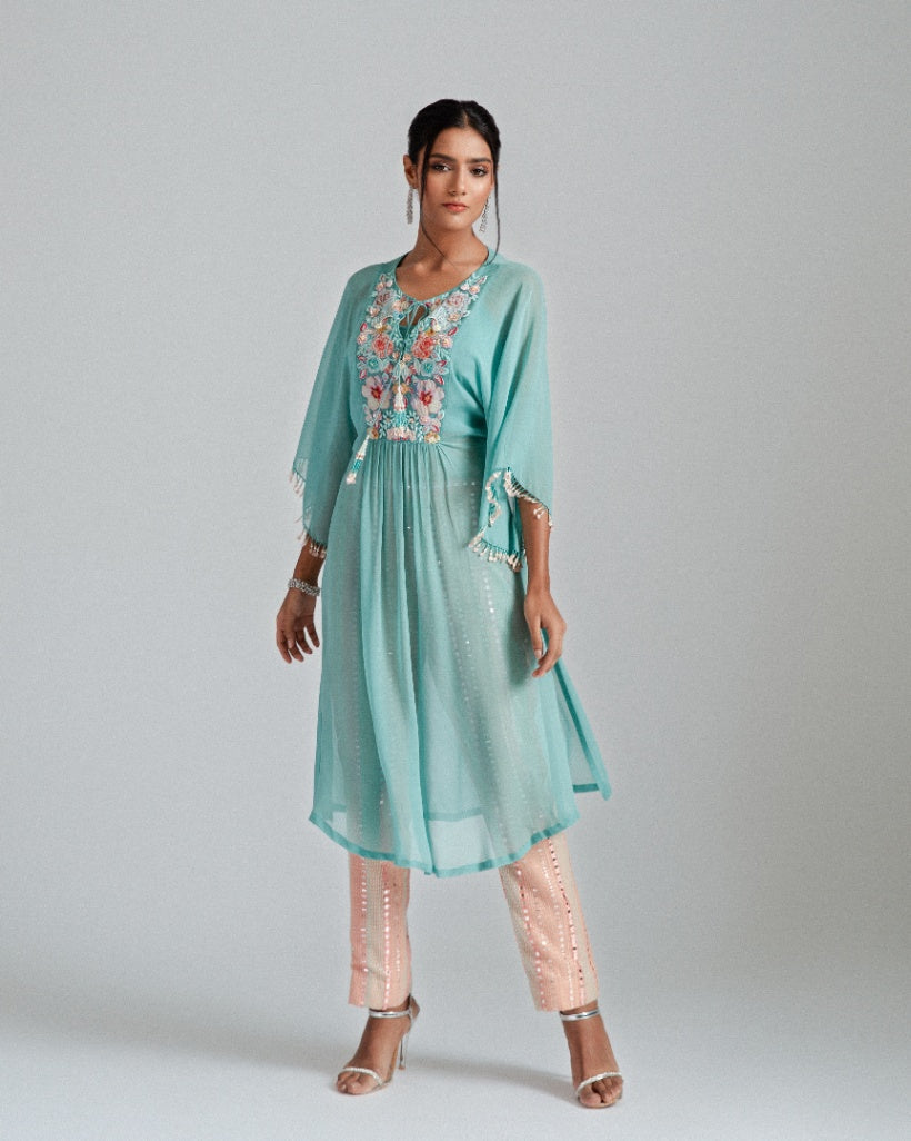 Georgette kaftan paired with mirror work trousers.