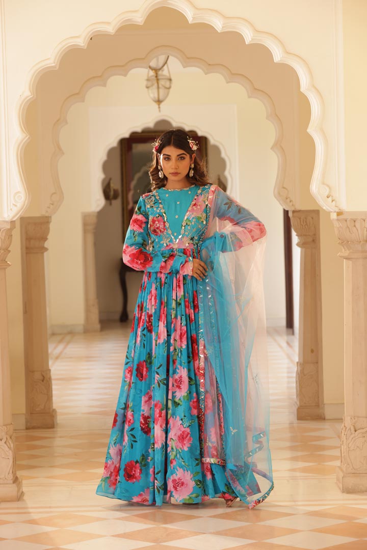 Image of Featuring Floral printed Anarkali with hand embroidered yoke and churidaar sleeves. Paird with double shadede net embroidered dupatta