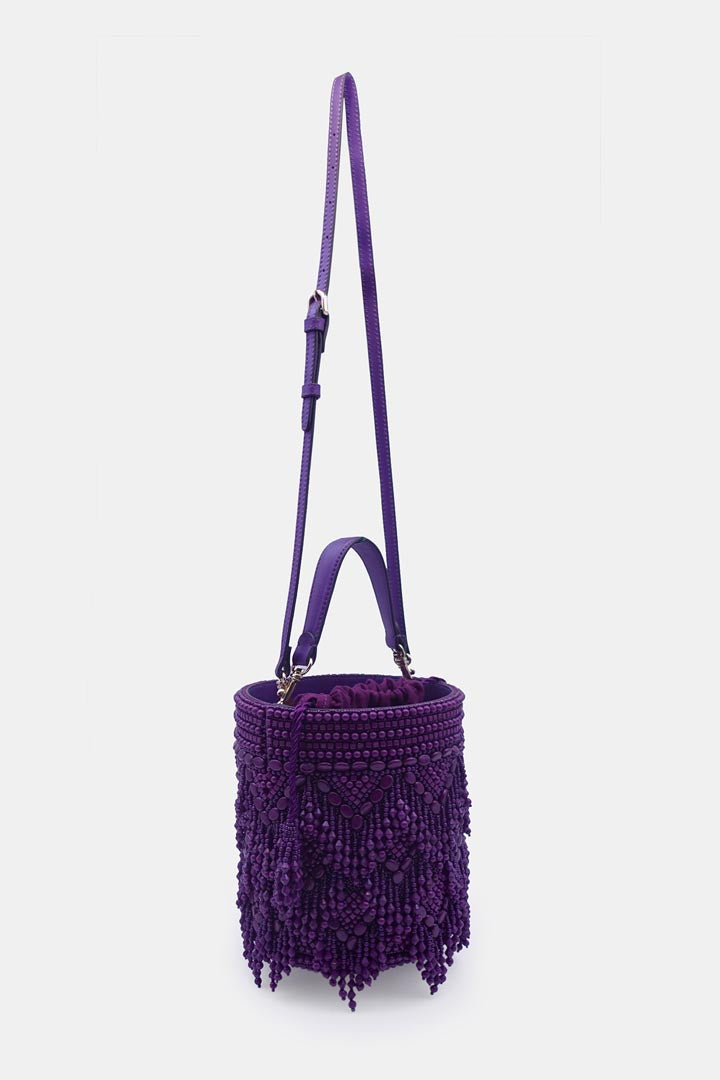 Handcrafted purple potli bag adorned with intricate bead embellishments