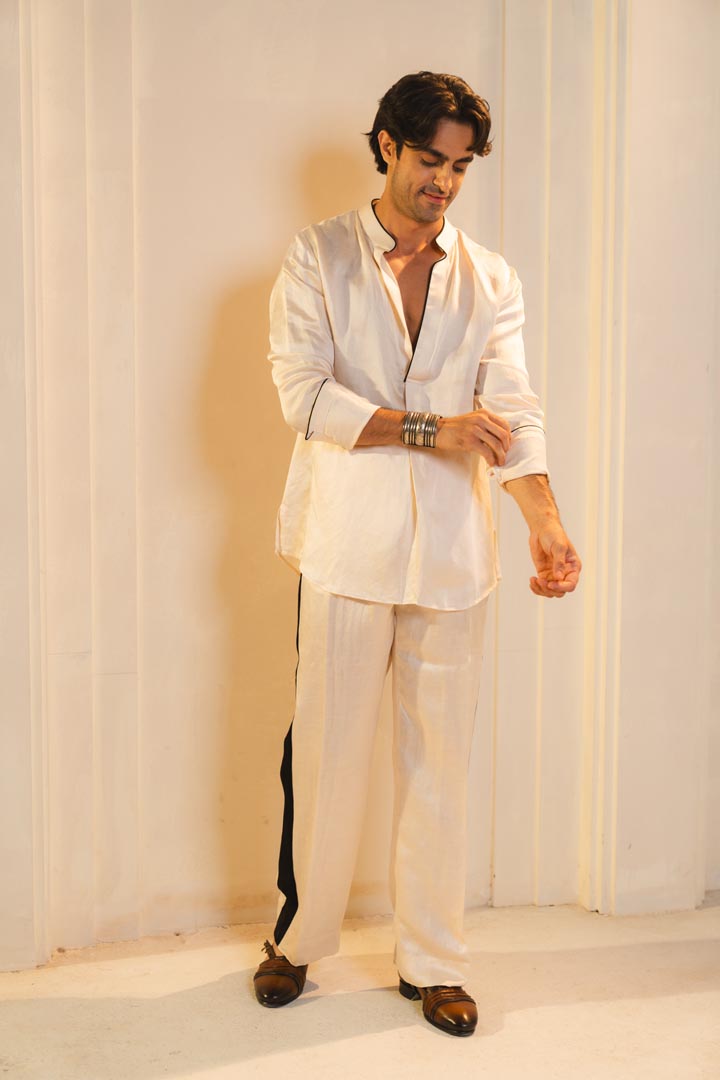Kurta set in Pearl Ash with black detailing.