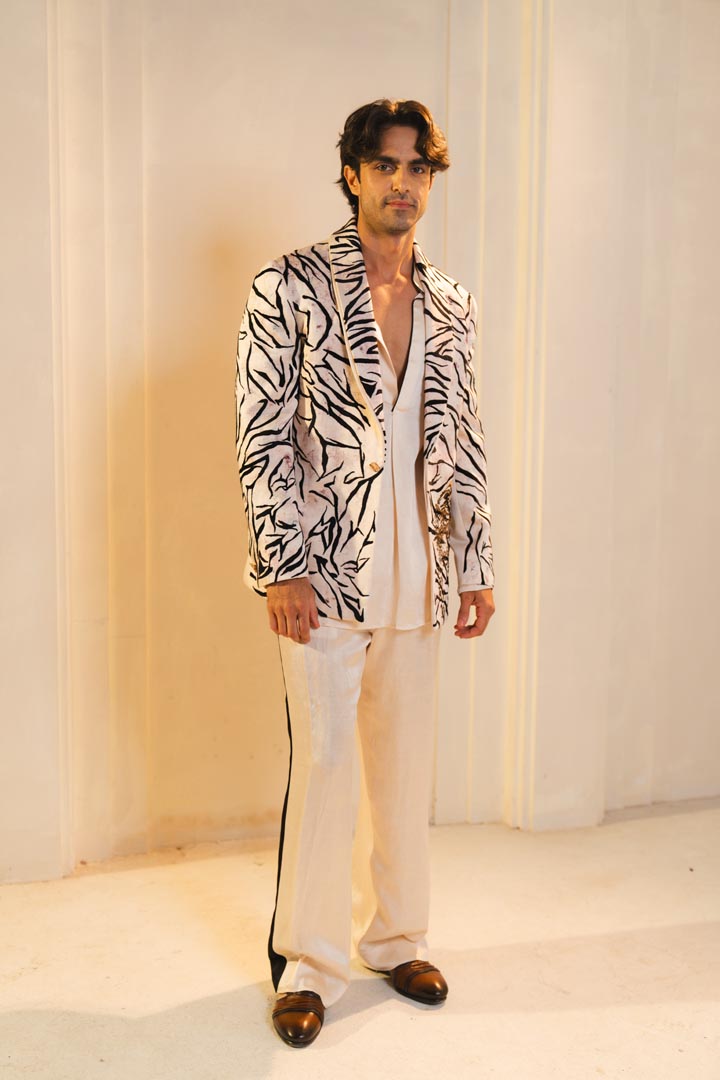 Concept blazer with hand paint and hand embroidery. paired with a matching kurta and trousers.