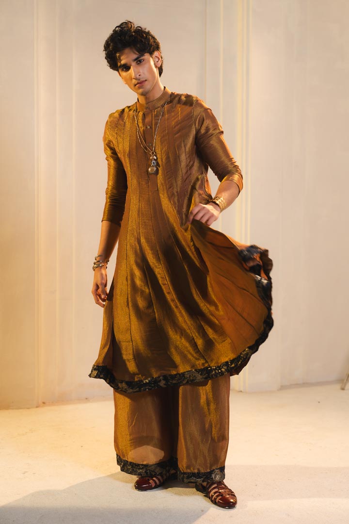 Anarkali kurta in gold, paired with flared trousers.
