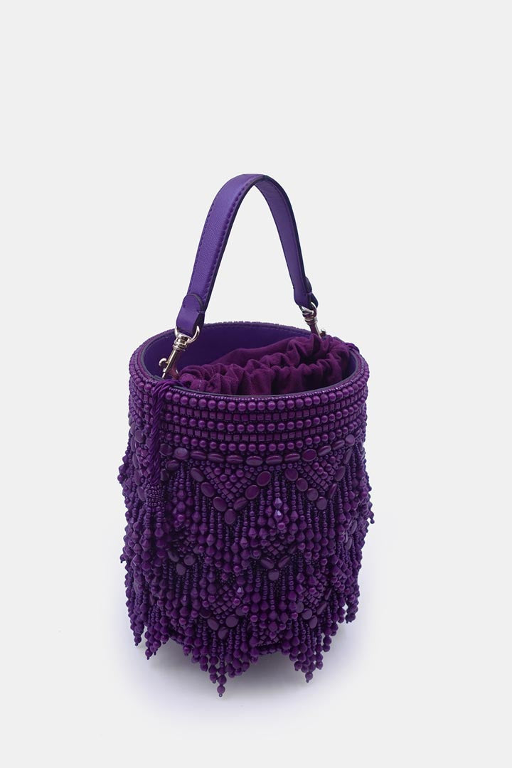 Handcrafted purple potli bag adorned with intricate bead embellishments