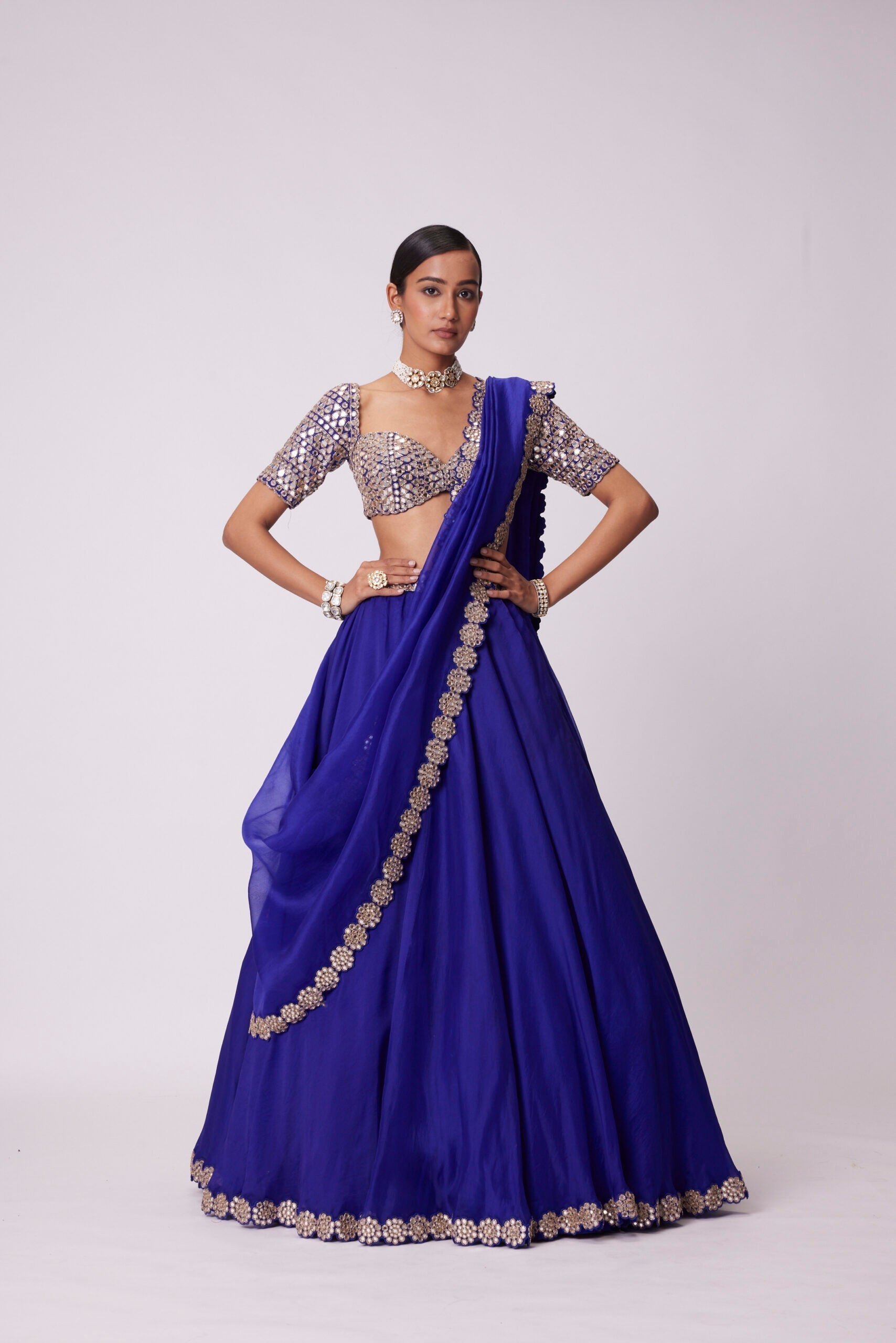 Image of PERSIAN BLUE ORGANZA HAND EMBROIDERED LEHENGA SET