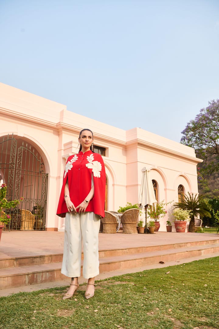 red and white embroidered cape