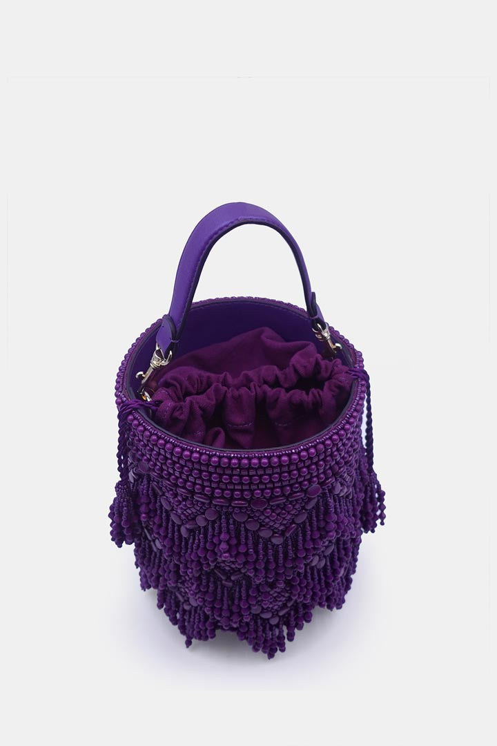 Handcrafted purple potli bag adorned with intricate bead embellishments