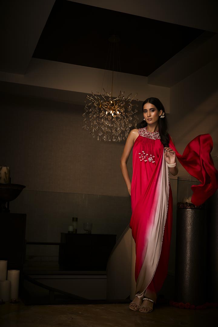A sangria silk satin pre-draped saree gown with intricate neckline embroidery.