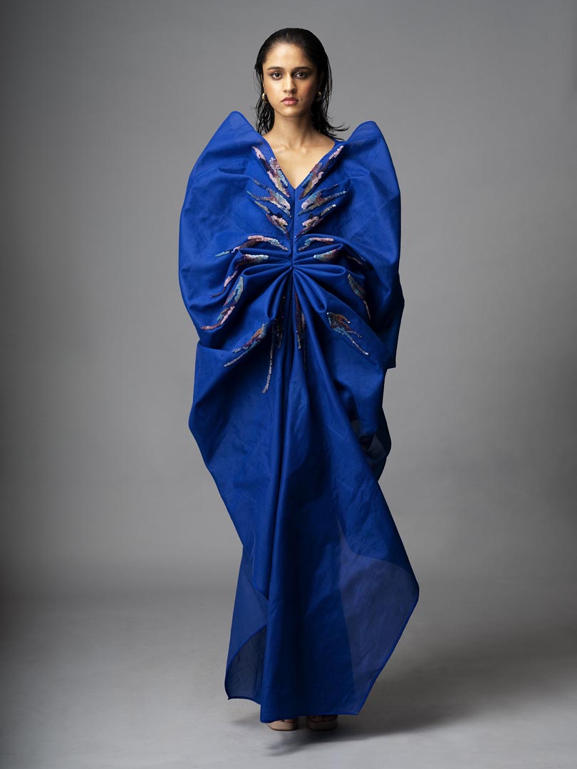 Teal sculpt dress in silk crepe with embellished brush stroke details.