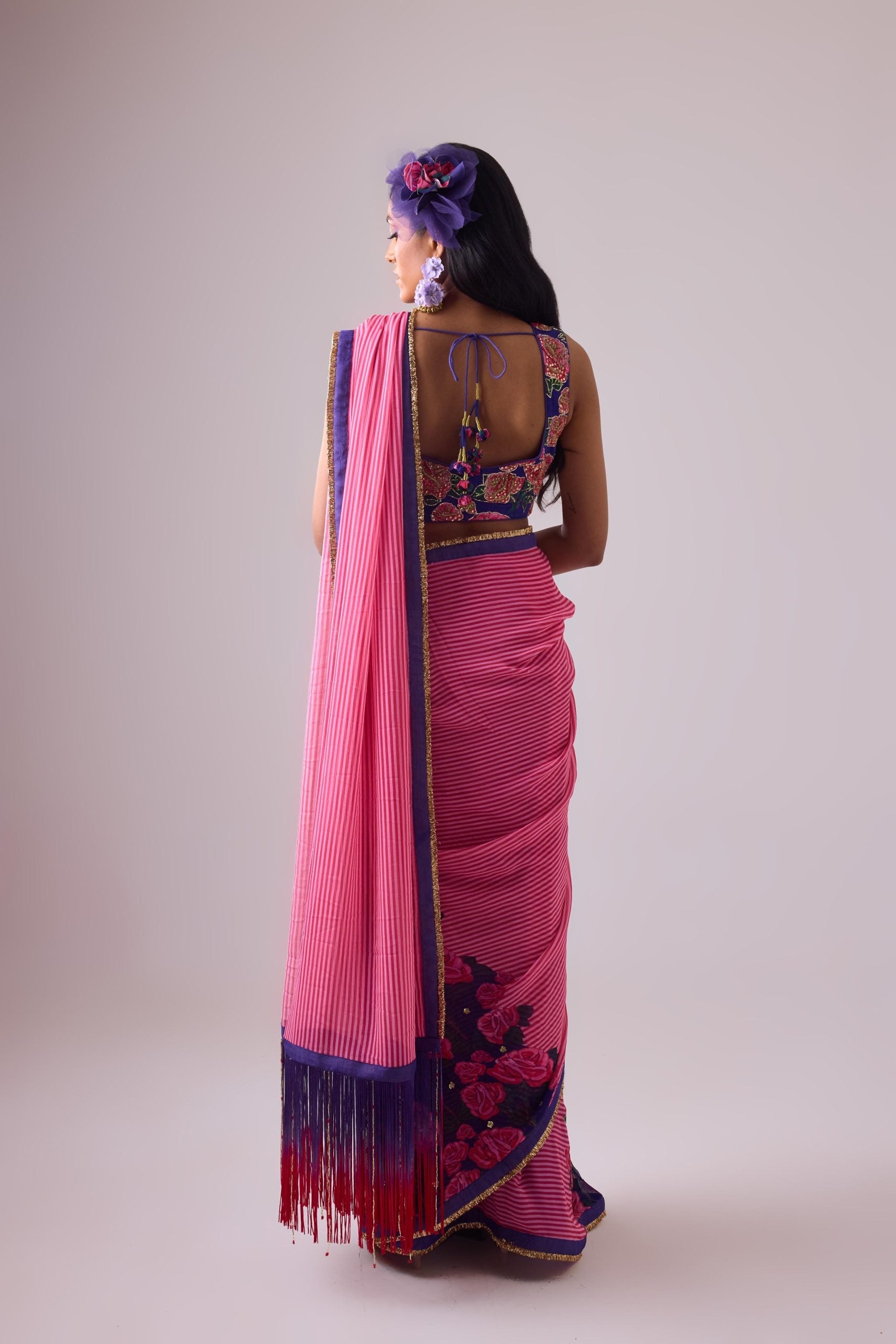 GEORGETTE STRIPED AND ROSE PRINTED SAREE WITH FRINGES DETAIL PAIRED WITH EMB. FLORAL BLOUSE