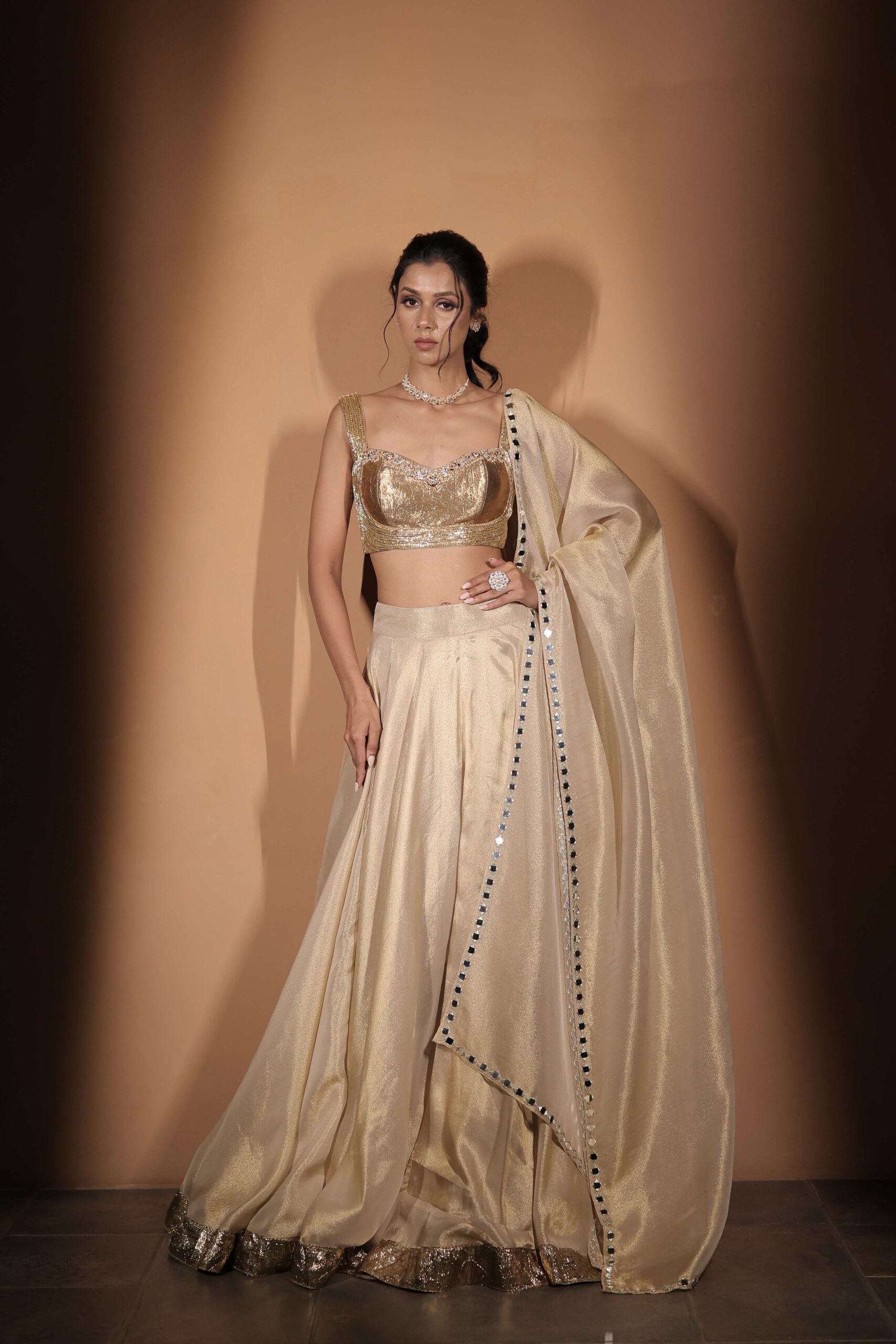 The " Son Pari " lehenga set / Ivory-gold jewel and mirror embroidered tissue lehenga set