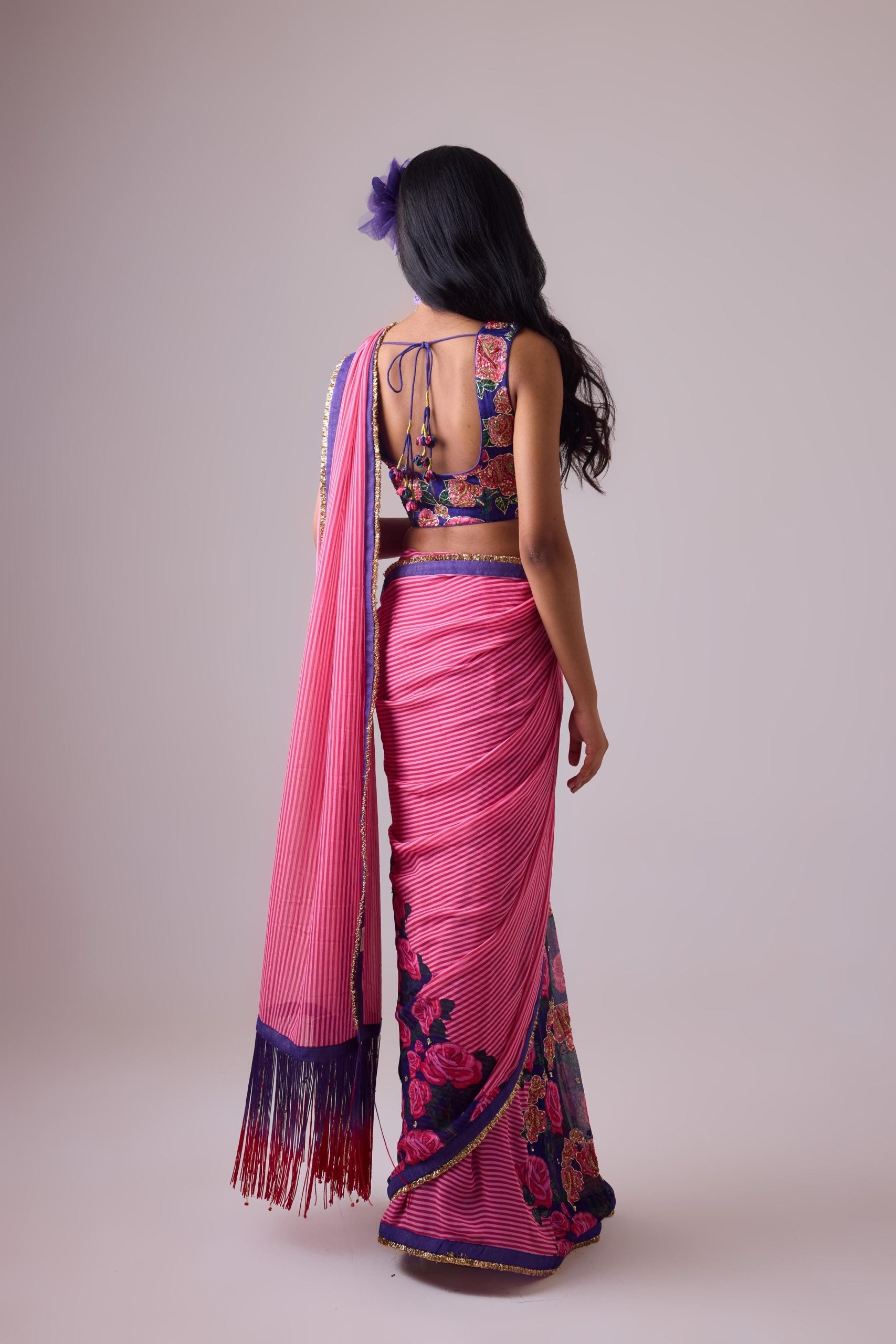 GEORGETTE STRIPED AND ROSE PRINTED SAREE WITH FRINGES DETAIL PAIRED WITH EMB. FLORAL BLOUSE