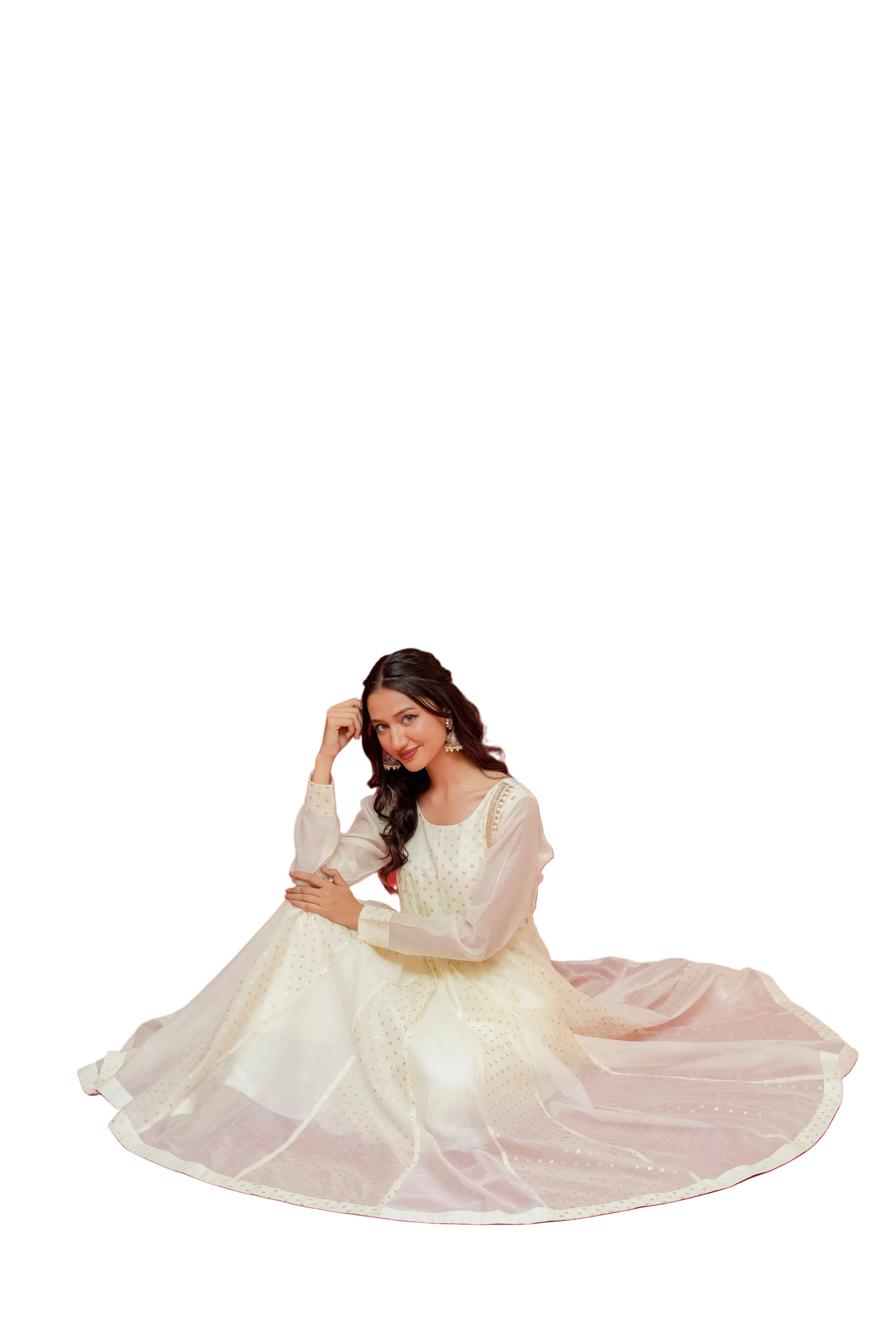 Woman in a white dress sitting on a red background with a veil