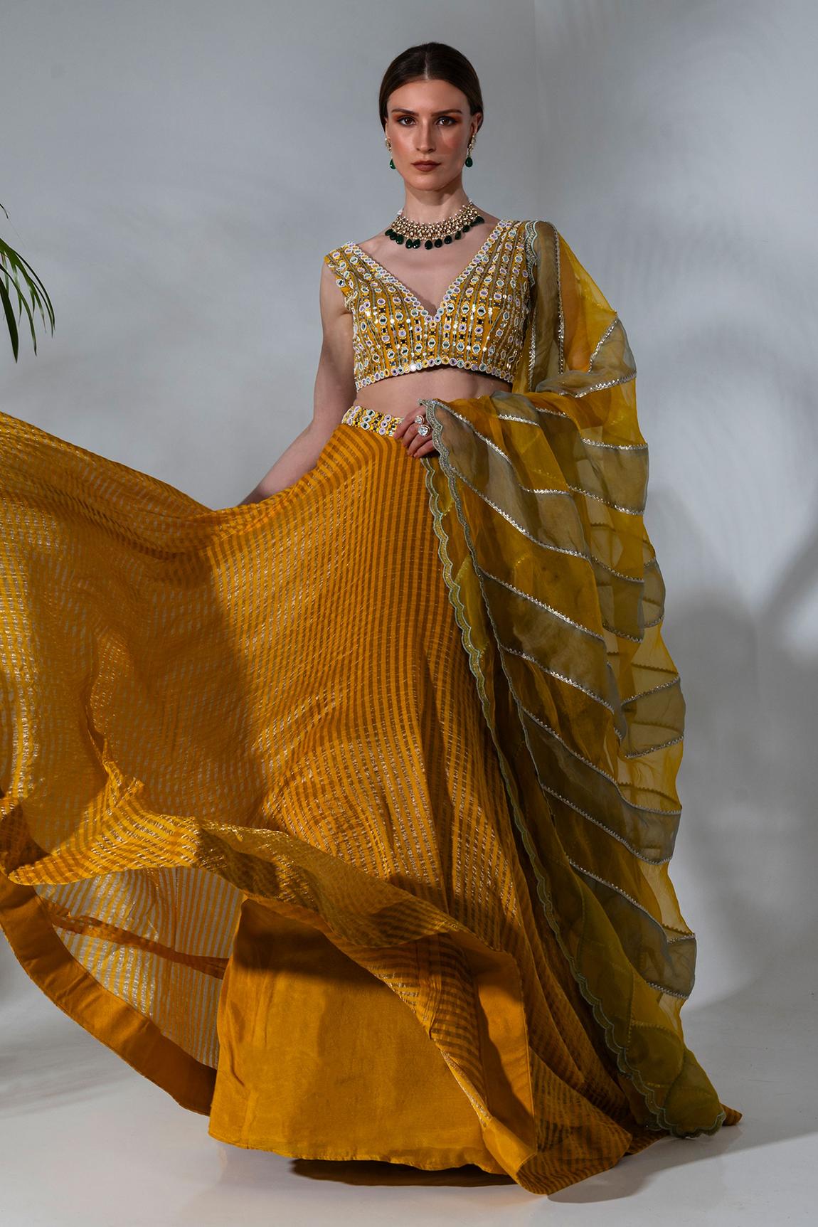 Yellow tissue silk lehenga with mirror work