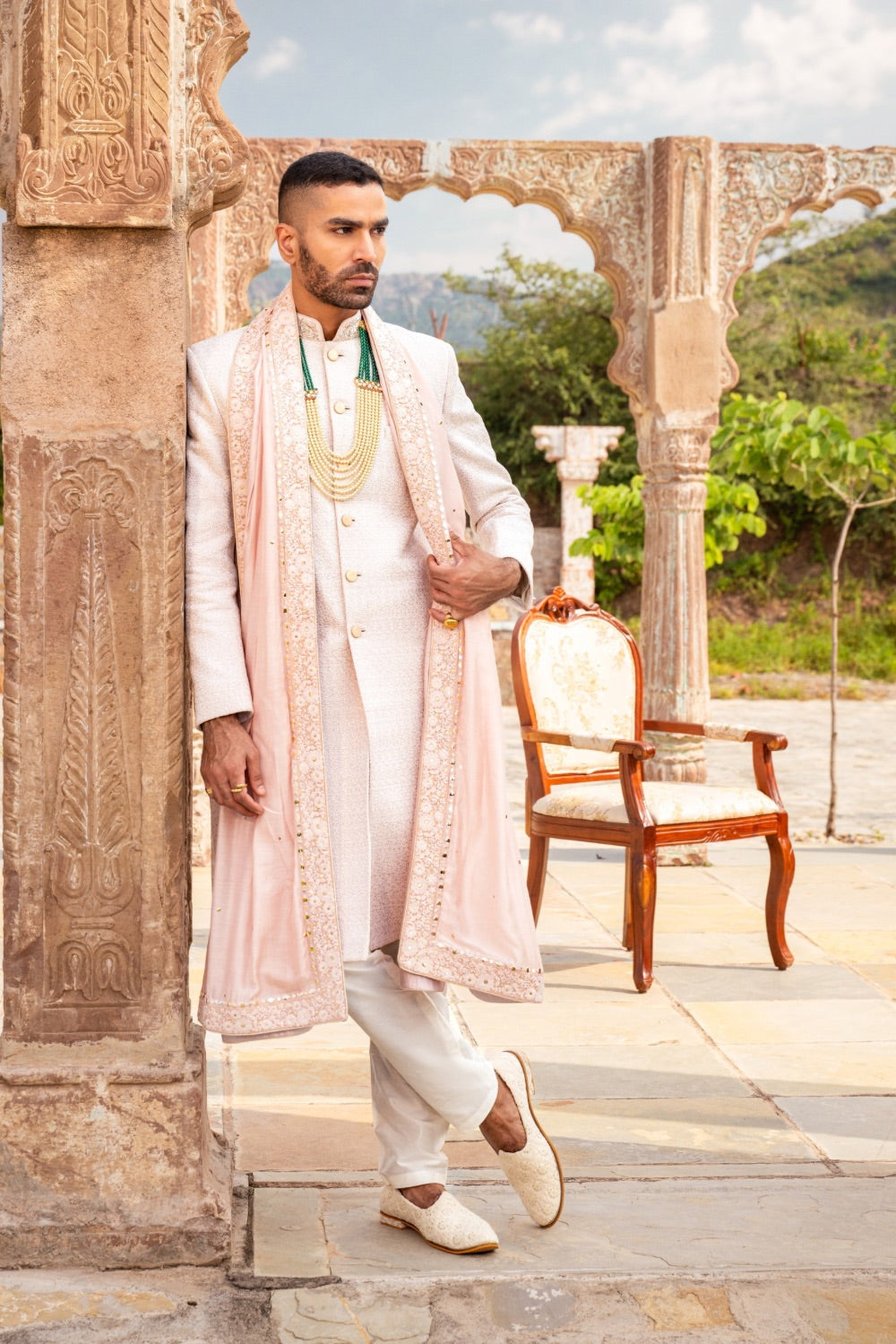 Cream silk sherwani with golden thread and resham work