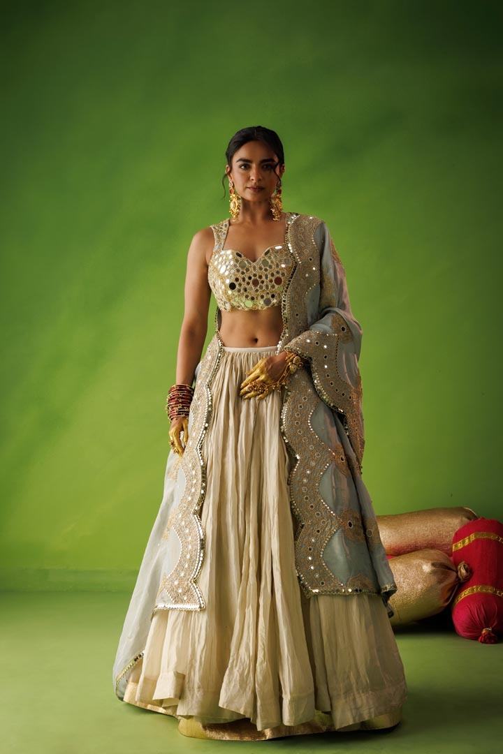 Beige crushed tissue lehenga set with blue dupatta