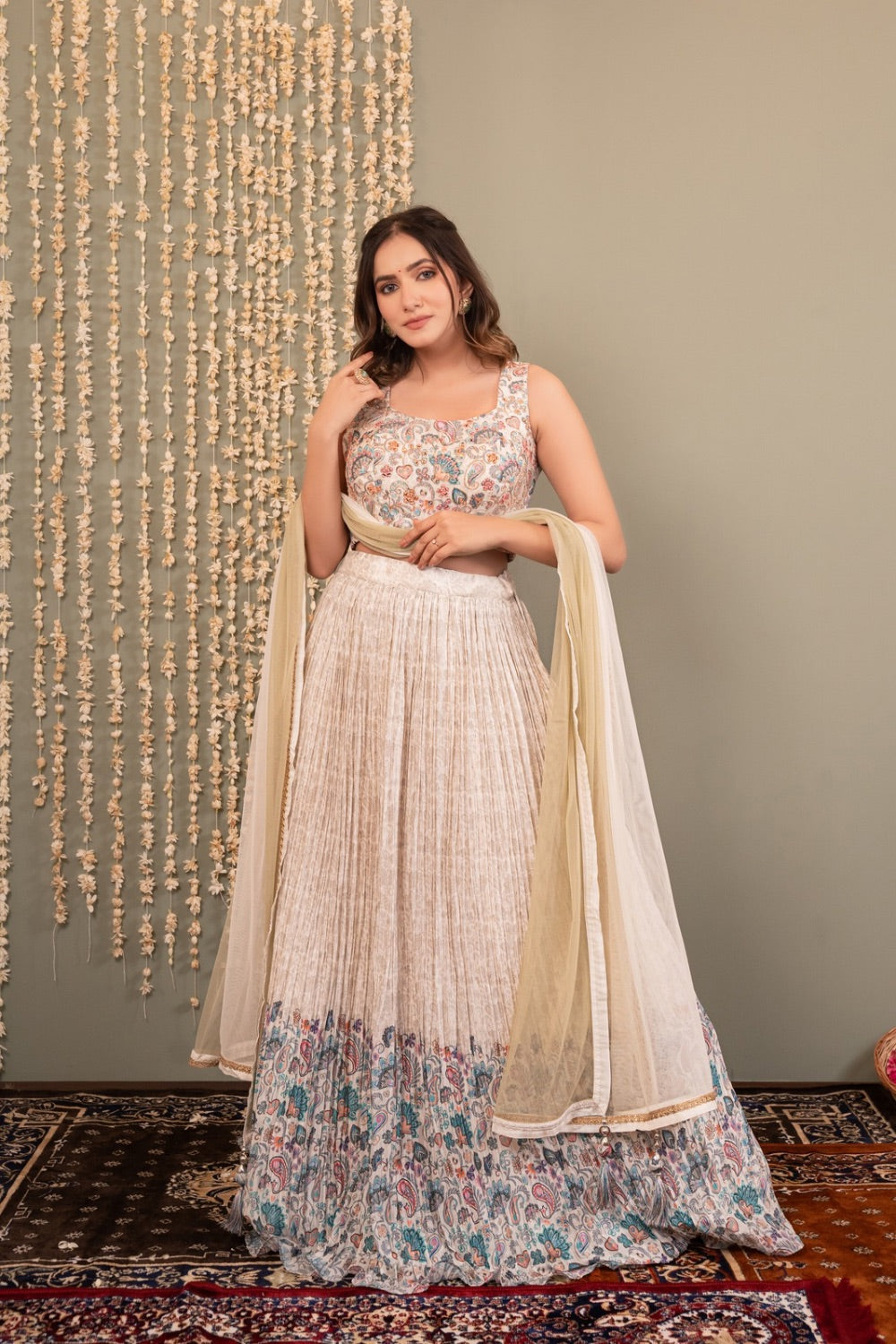 Cream white crepe silk lehenga choli with printed and mirror work