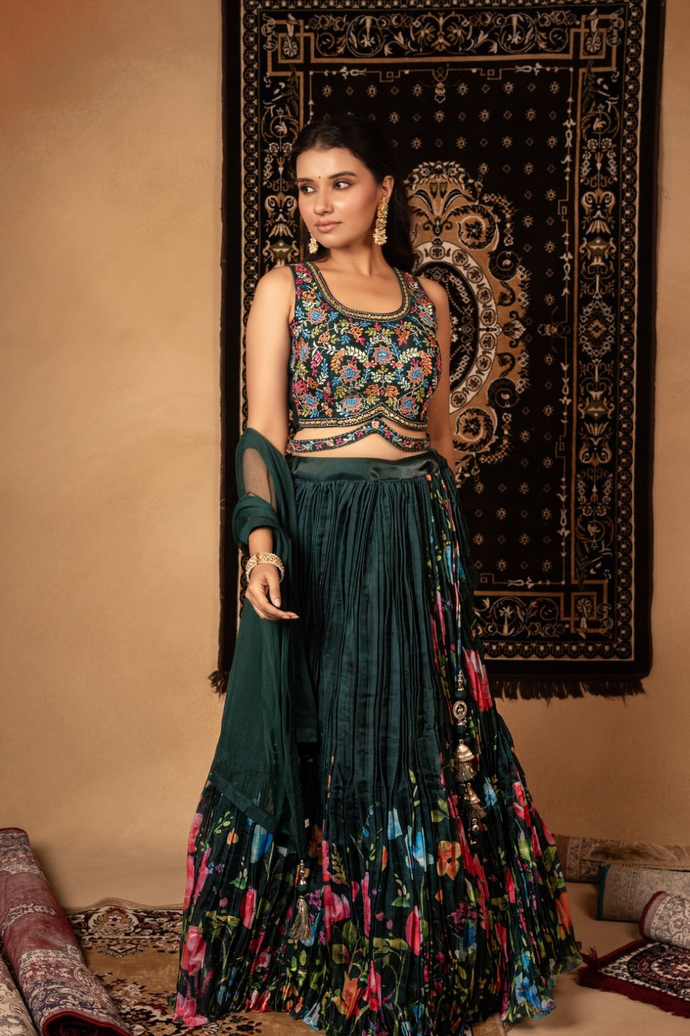 Dark green silk lehenga choli with resham and mirror work