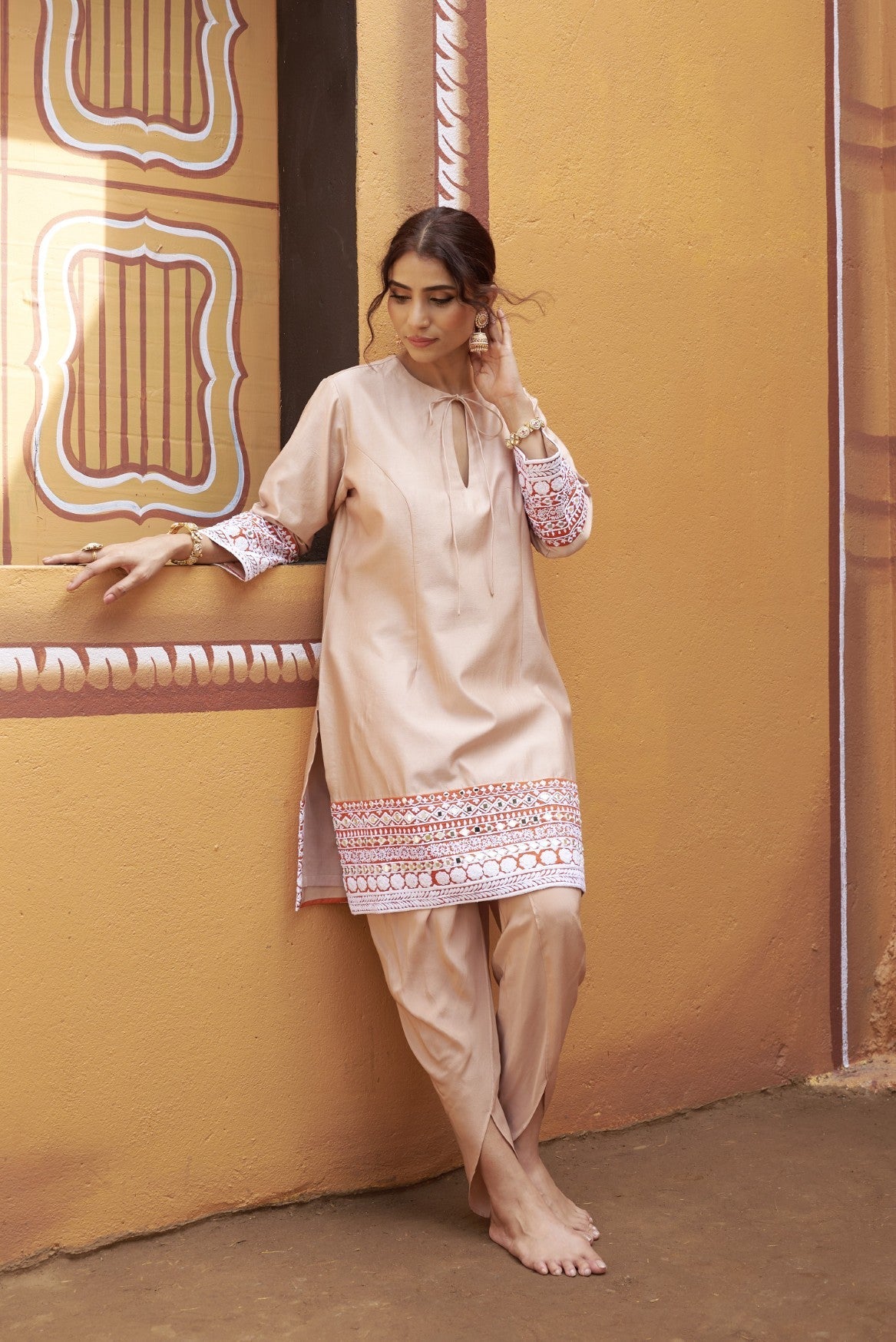 half and half beige kurta with tulip pants