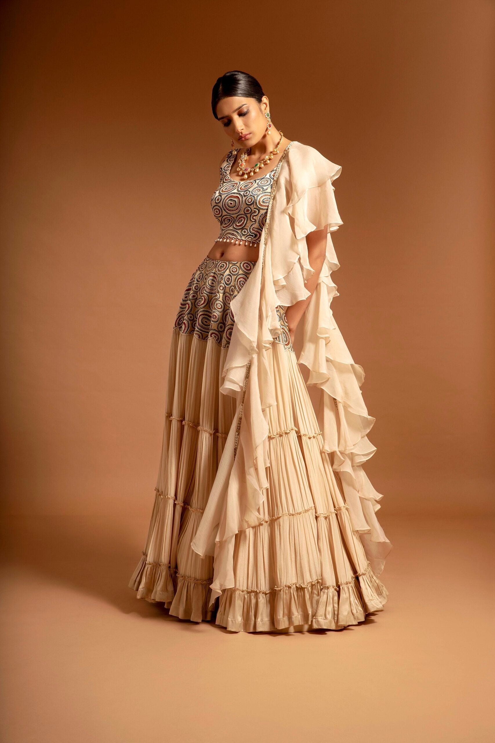 Beige fully embroidered ajrakh blouse with tiered lehenga and ruffle dupatta set