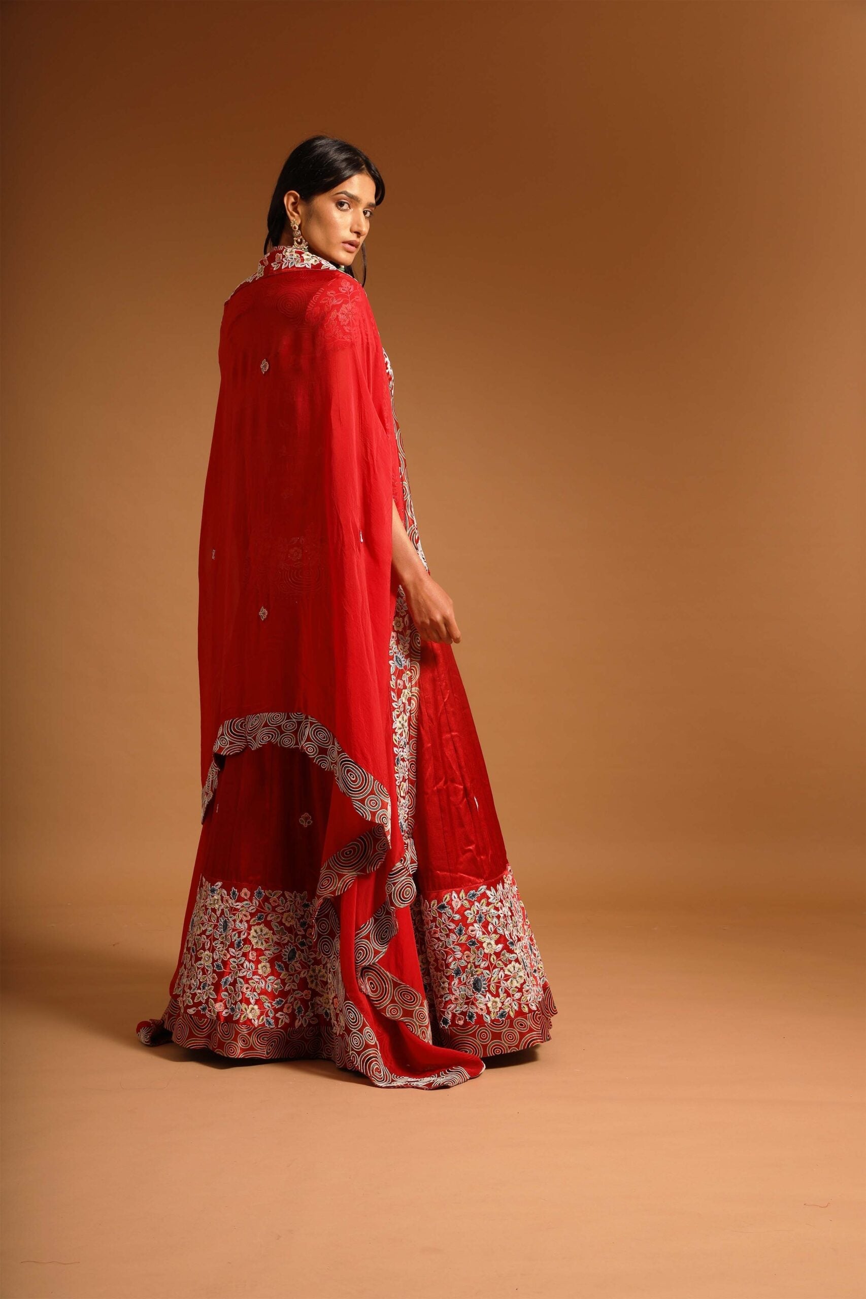 Red fully handcarfted jacket with lehenga and cape dupatta