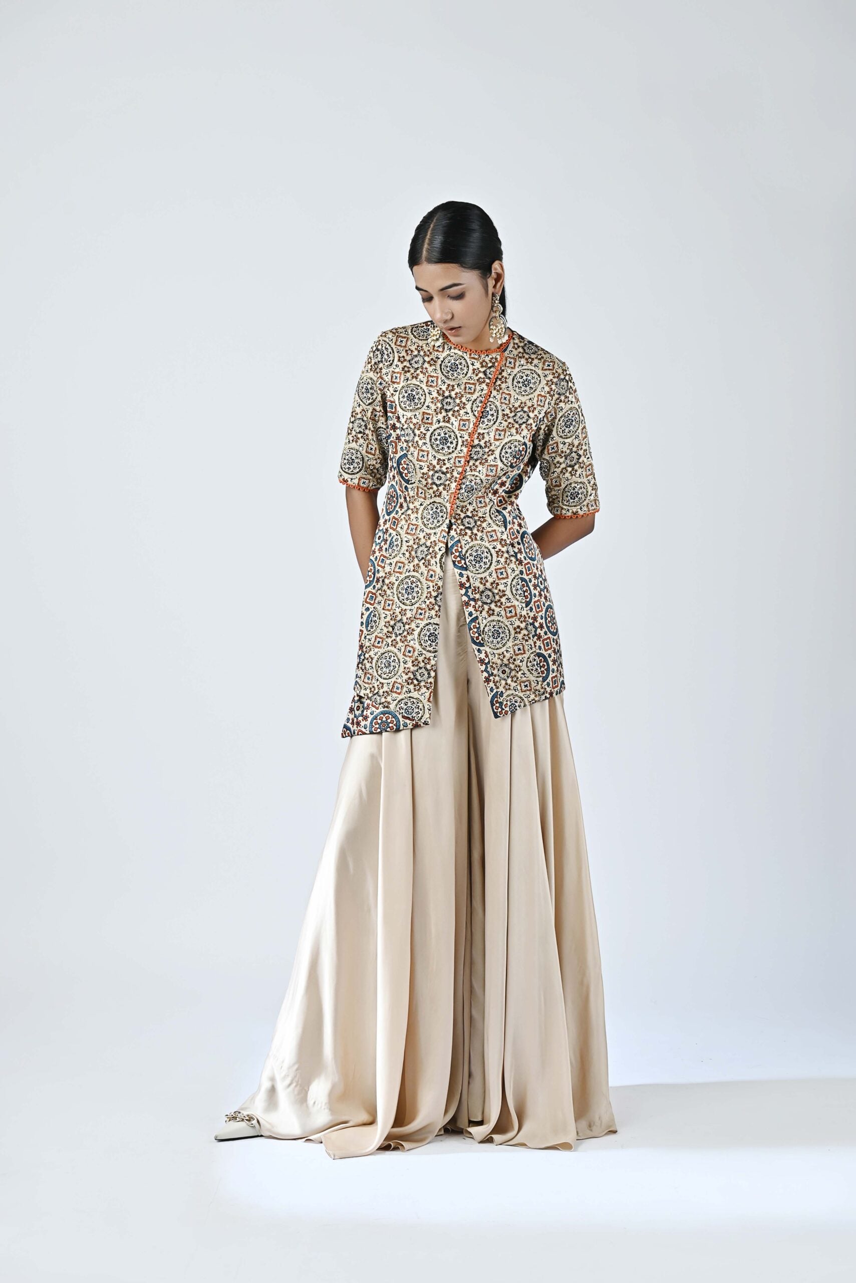 Beige embroidered jacket with flare pants