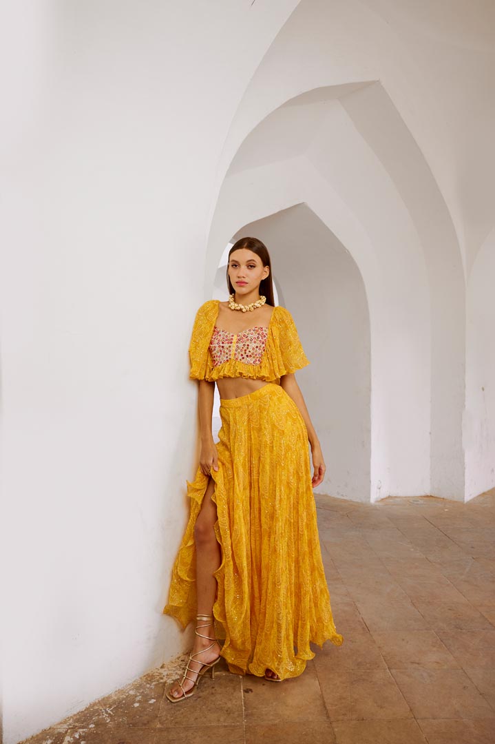 Image of Gulbahar Marigold yellow  jugnu sitara butterfly blouse with flair skirt set.