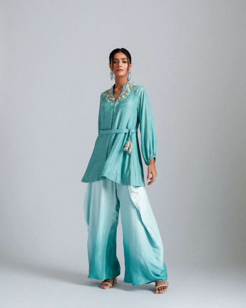 Aqua ombre silk mul mul tunic jacket with a belt and paired fusion dhoti drape trousers. 