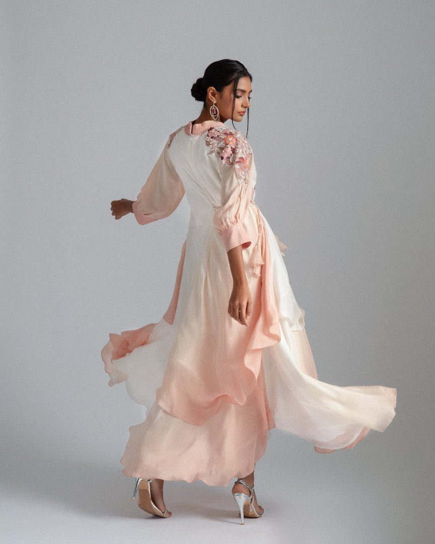 An off-white to Champagne ombré handkerchief-cut asymmetrical drape with a one-side tie and floral motifs. 