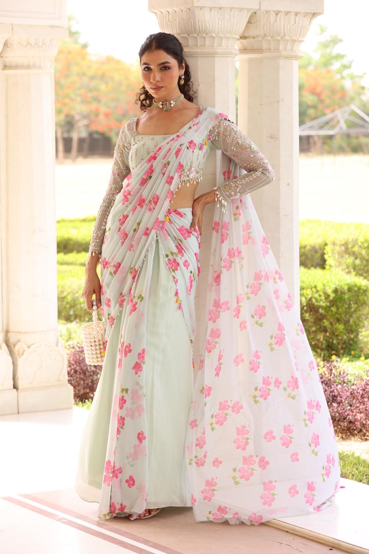 Image of Georgette Pre- Drape Saree with Bias flare and pallu of floral Printed chiffon. Paired with heavily embroidered blouse with pearl details on hem