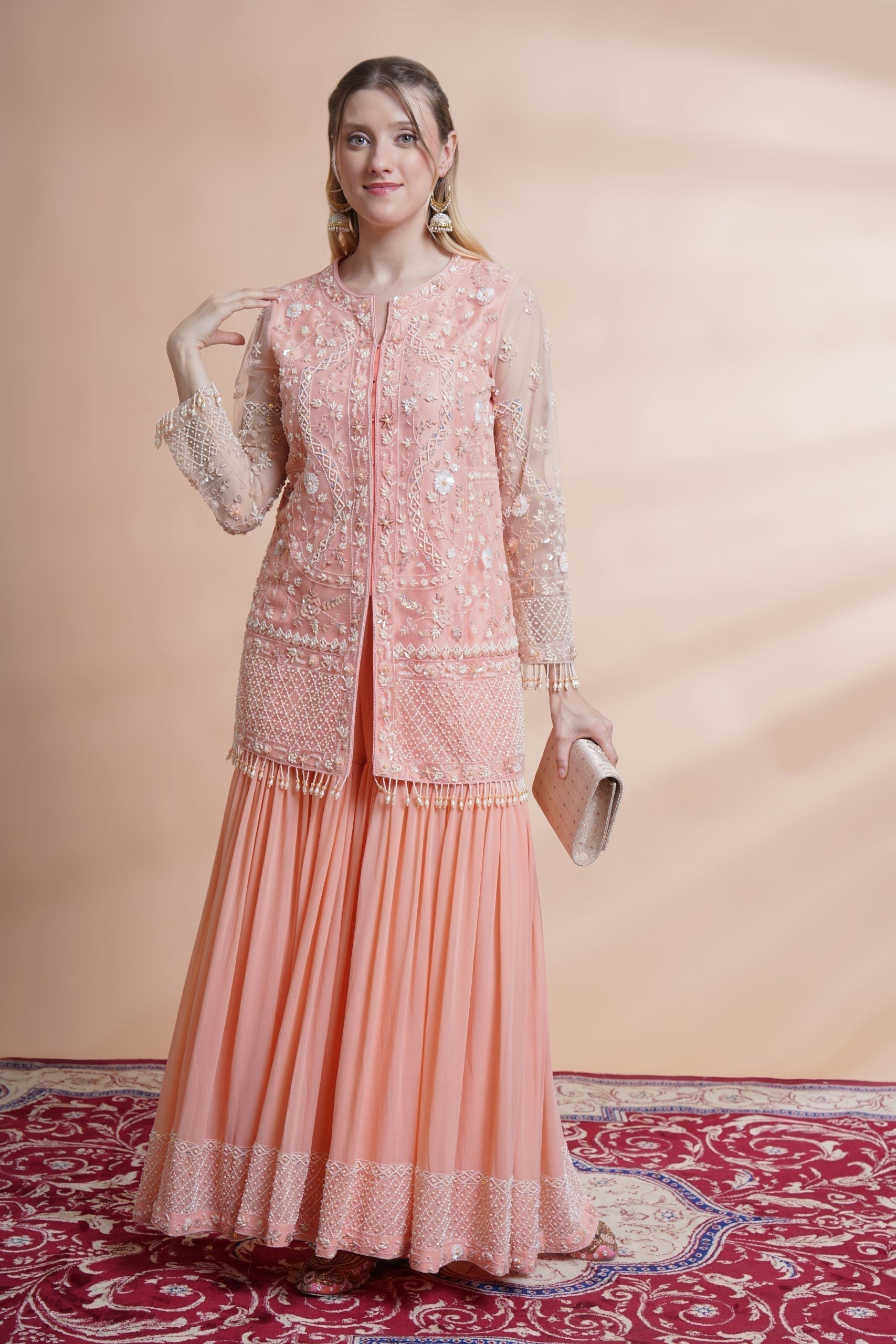 Image of Peach net kurta sharara set