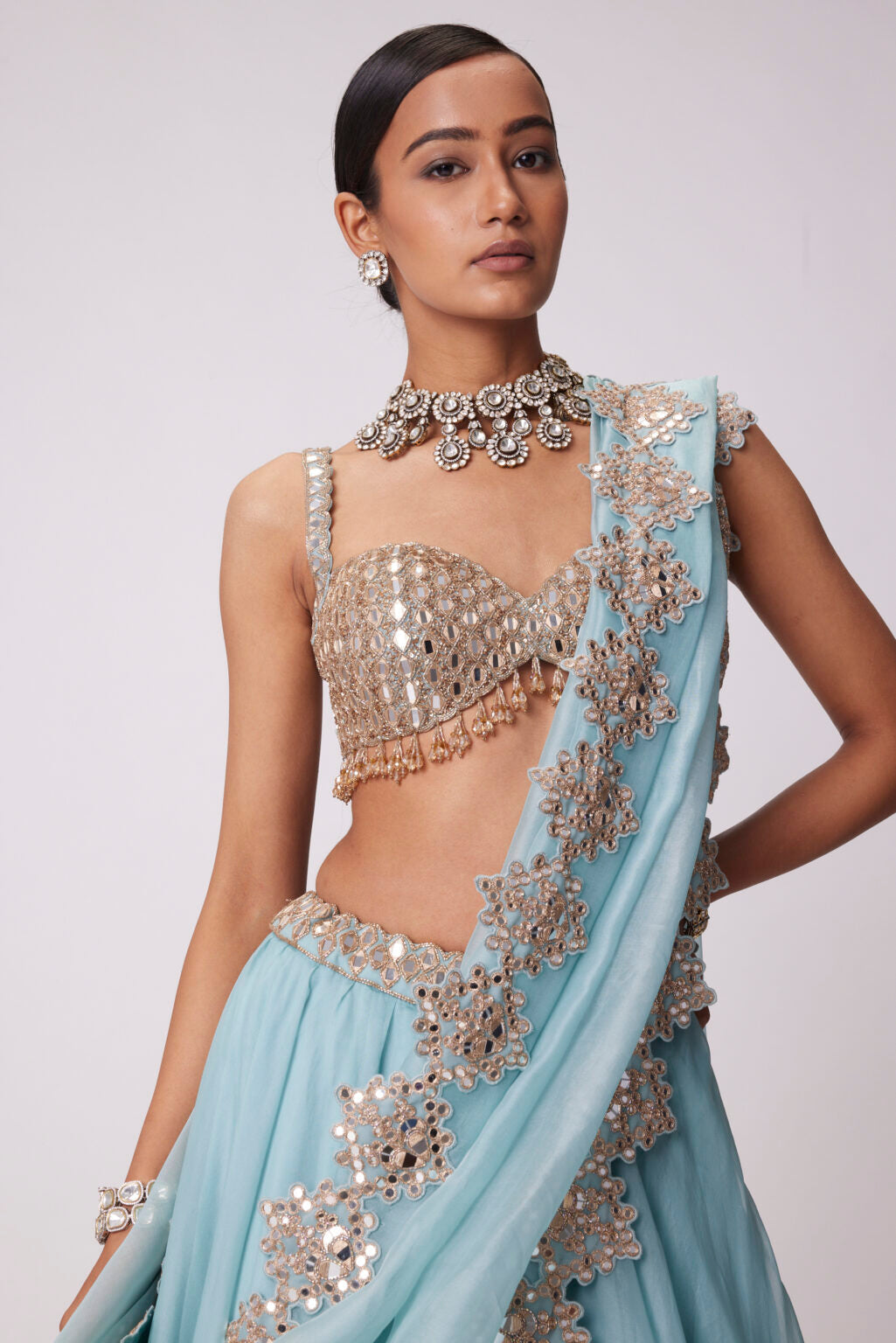 Image of POWDER BLUE ORGANZA HAND EMBROIDERED LEHENGA SET