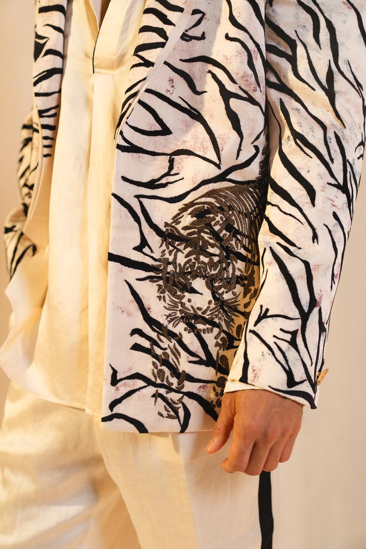 Concept blazer with hand paint and hand embroidery. paired with a matching kurta and trousers.