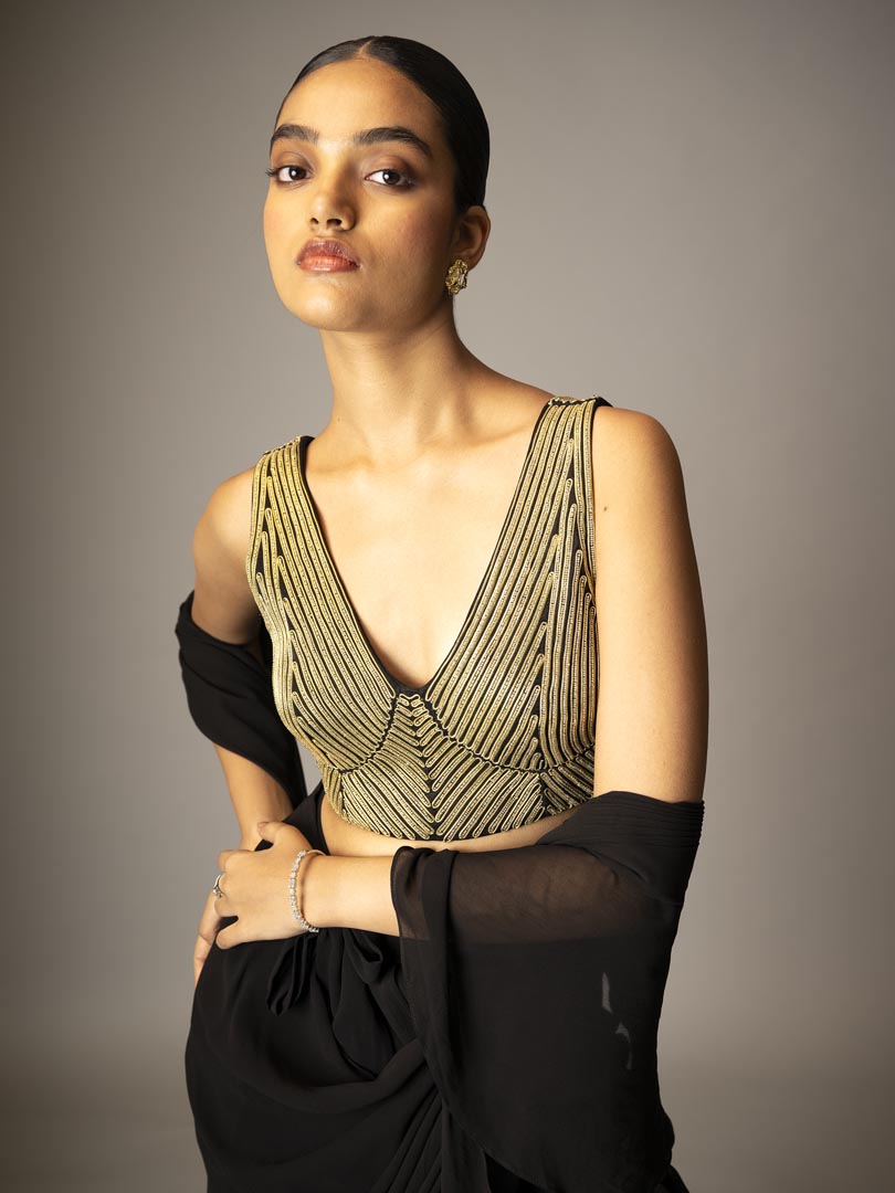 Black pre-draped saree gown
with metallic 3D dori Embellished blouse.