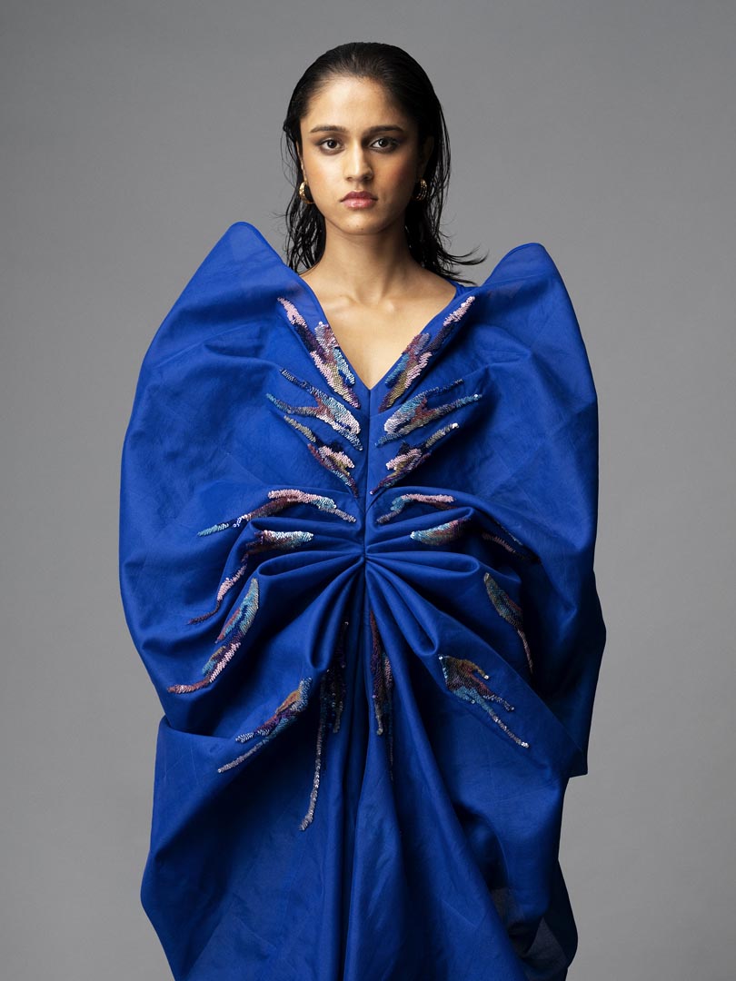 Teal sculpt dress in silk crepe with embellished brush stroke details.